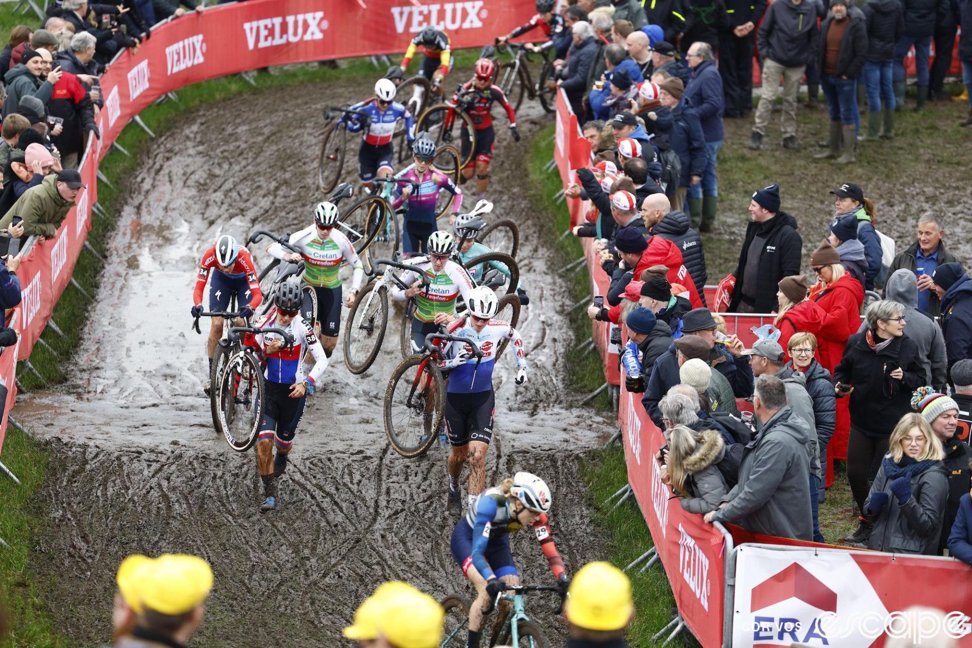 Women racers tackle another day of mud at Dendermonde World Cup. Some are riding, some are running, and the mud is just as soupy as the day before.