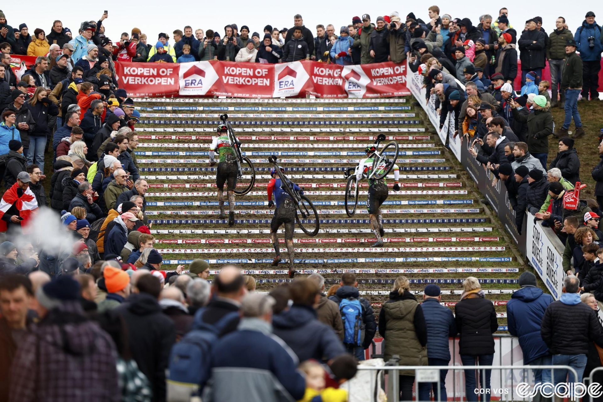Three riders climb a set of stairs at the Dendermonde World Cup.