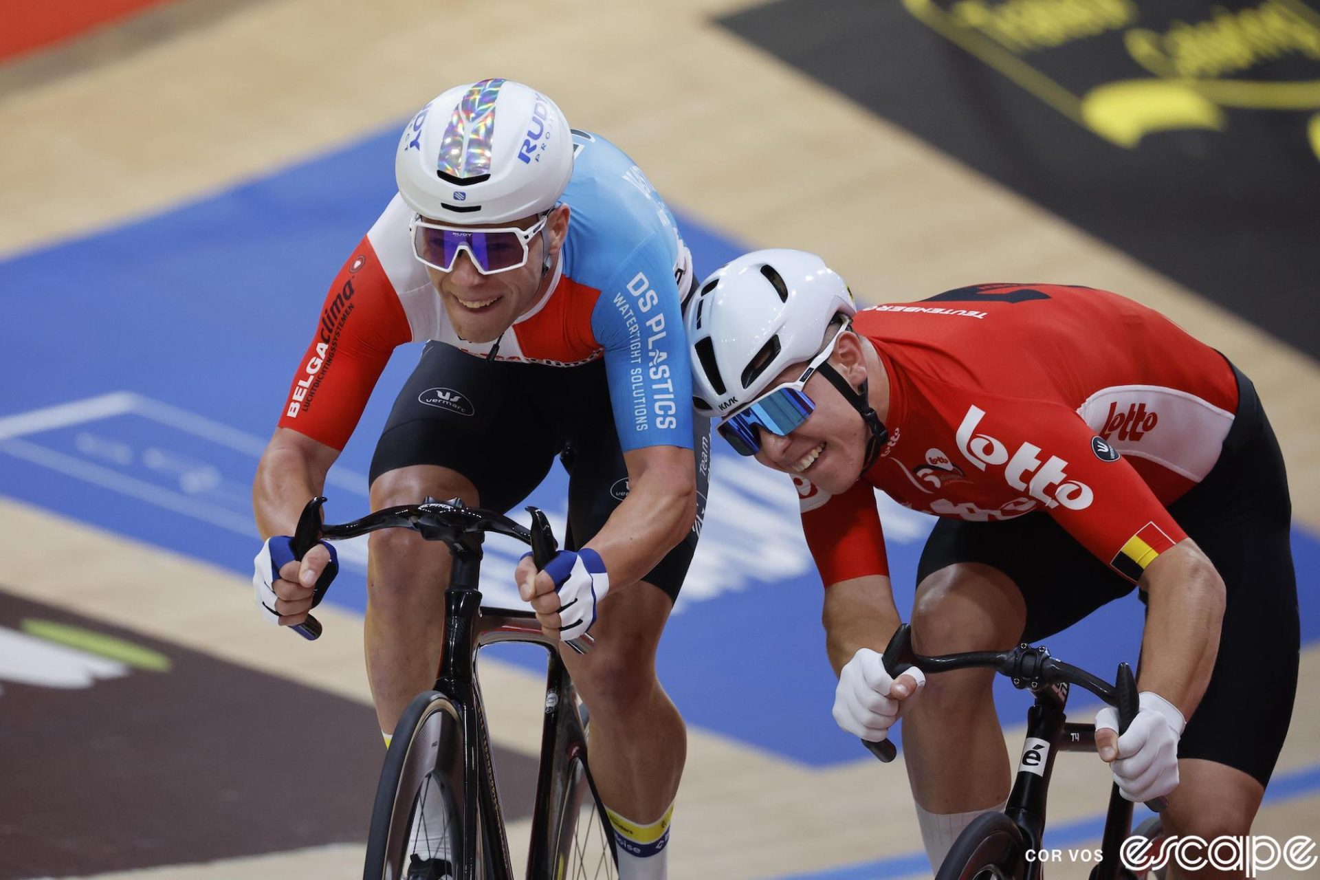 Jules Hester leans his head against Gianluca Pollefliet's shoulder during a race as the two are in each other's space.