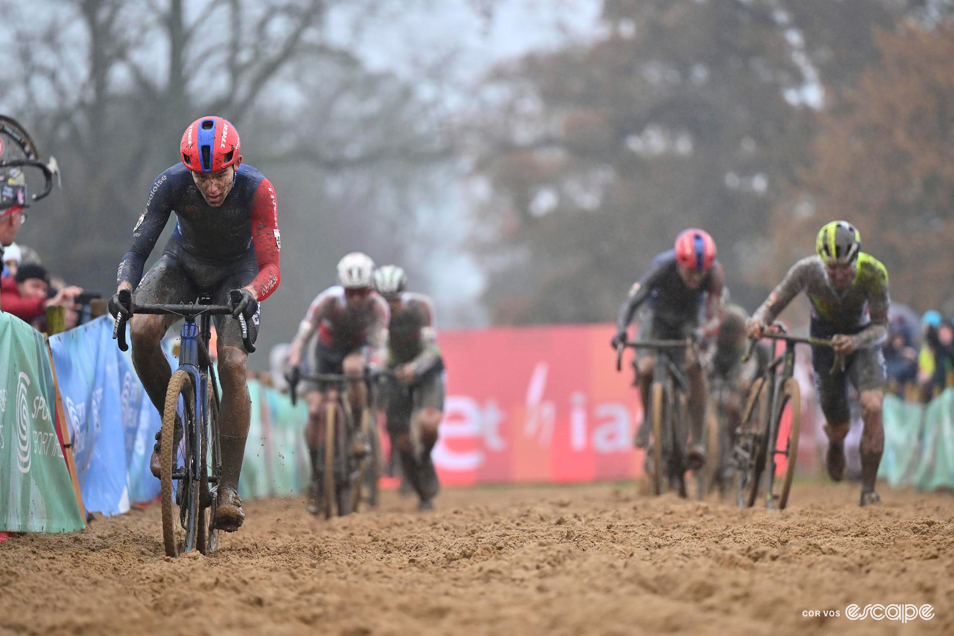 Thibau Nys rides up the righthand side (left of picture) of the sandpit a few seconds ahead of the chase group, some of them dismounting to run with their bikes early in CX World Cup Dublin.