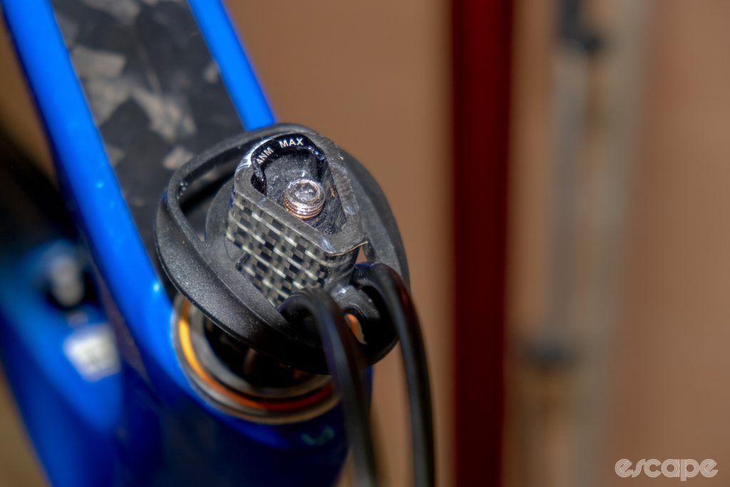 The photo shows the proprietary expander bung, Delta steerer, headset cap, and brake hose routing through into the headset on a new Cannondale SuperSix Evo Hi-Mod 2 with 10 mm of spacers.