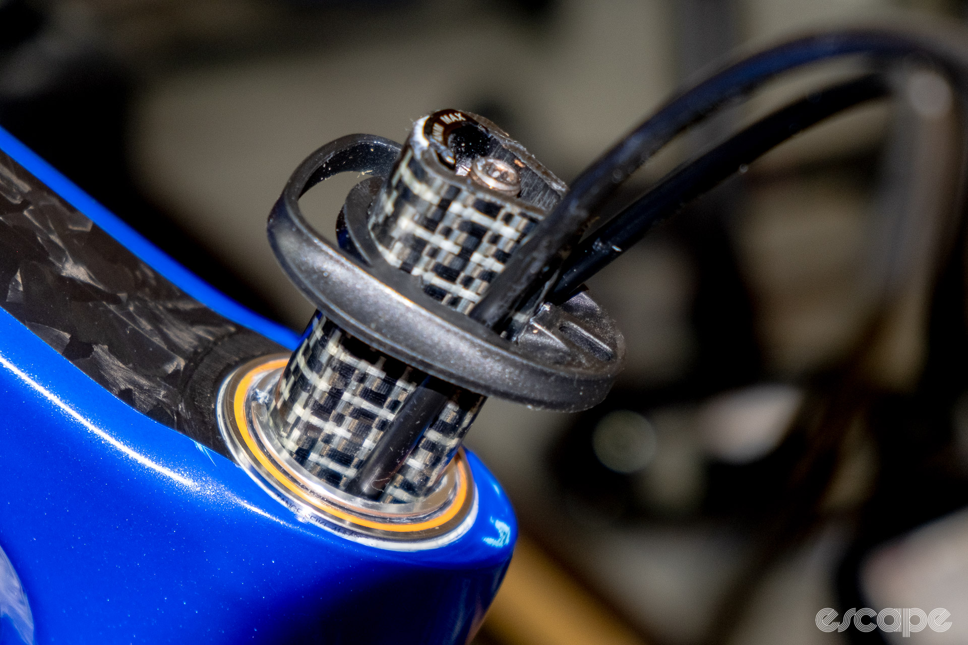The photo shows the Delta steerer, headset cap, and brake hose routing through into the headset on a new Cannondale SuperSix Evo Hi-Mod 2 with 10 mm of spacers.