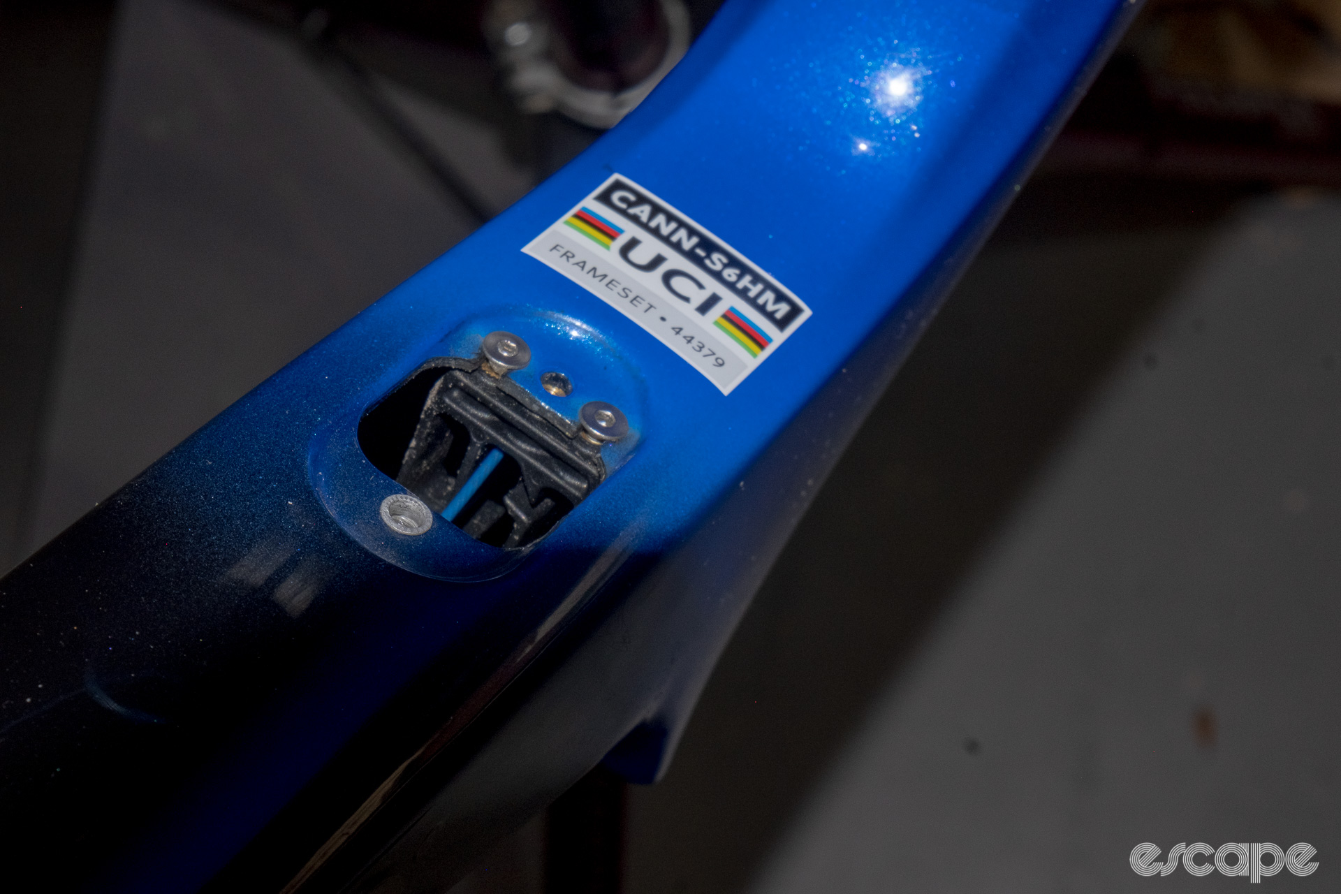 The photo shows the down tube Di2 junction box port and hose guide on a new Cannondale SuperSix Evo Hi-Mod 2.