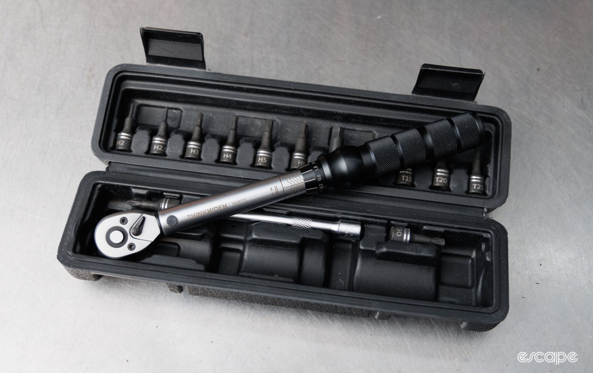 ThinkRider torque wrench sitting on its black plastic blow mould case with sockets. 
