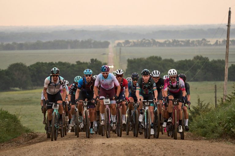 The lead group crests a climb at the 2023 Unbound Gravel event.
