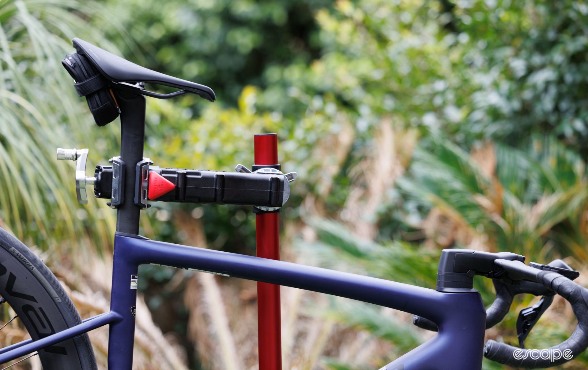 Feedback Sports stand being used in a backward setting that allows for clamping of aero seatposts. 