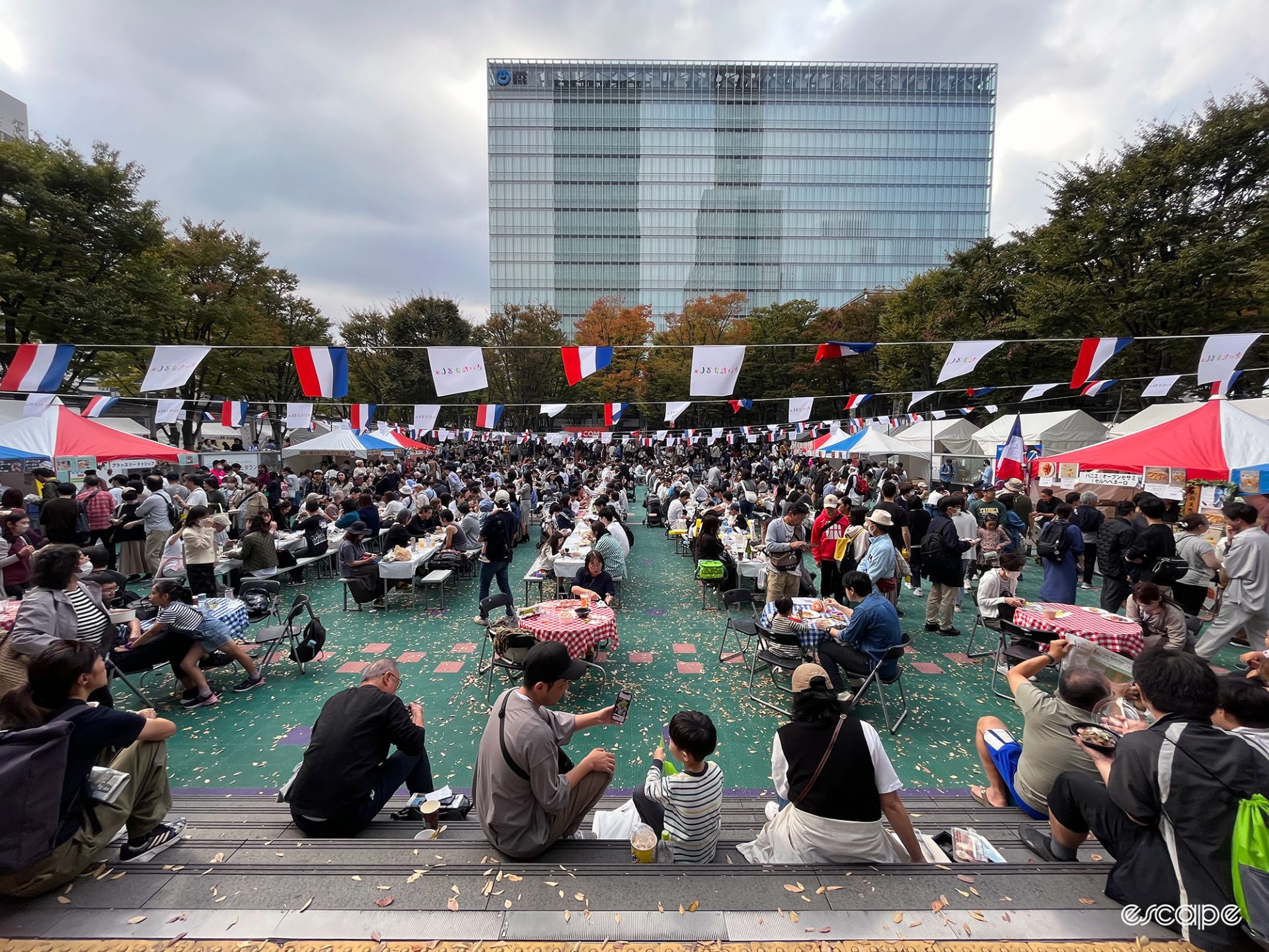 A food market decorated in French flags by Saitama station.