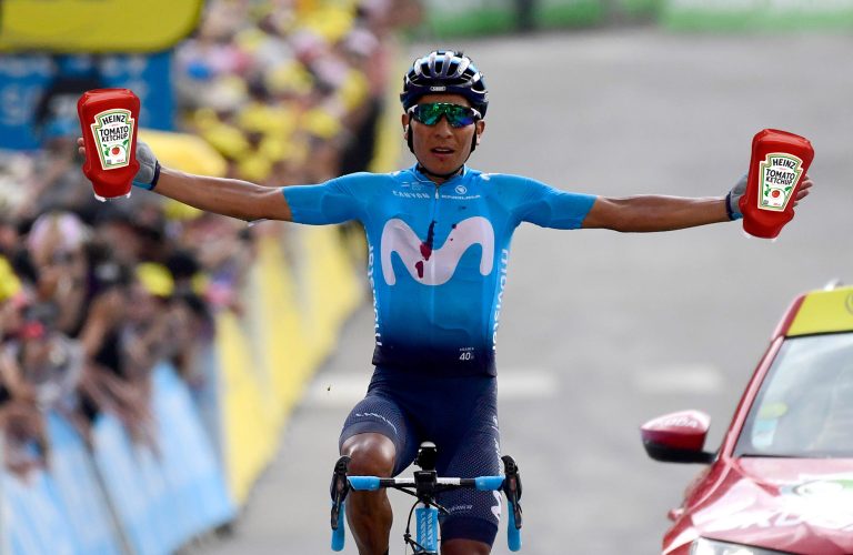 Composite image of Nairo Quintana winning a stage, with photoshopped bottles of sauce in each hand.