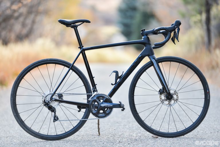 The Trek Emonda ALR5 shown in profile, with all-black paint and parts.