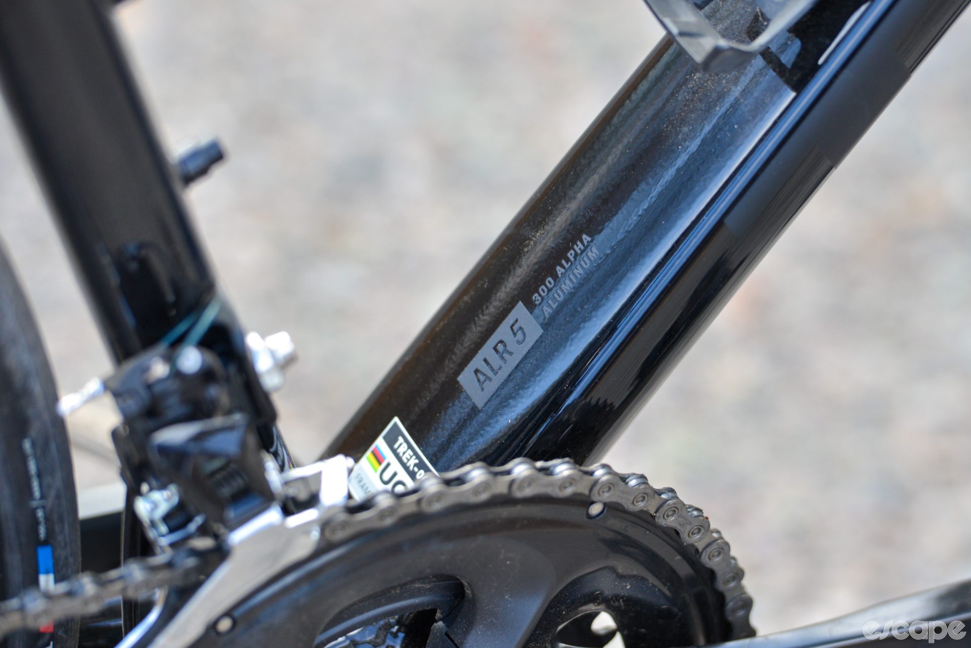 The chunky, wide downtube, with a 300 Alpha Aluminum decal and a UCI-approved sticker.