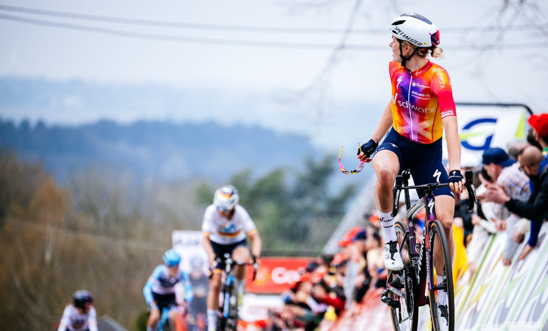Demi Vollering looks over her shoulder to locate her competitors at the finish of the 2023 Fleche Wallonne. 