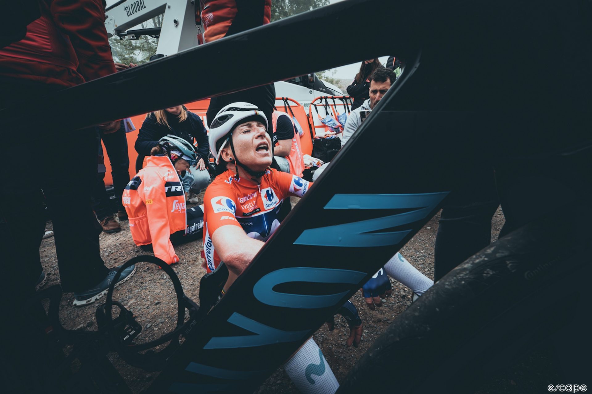 Annemiek van Vleuten gasps for breath, seen through her bike frame.