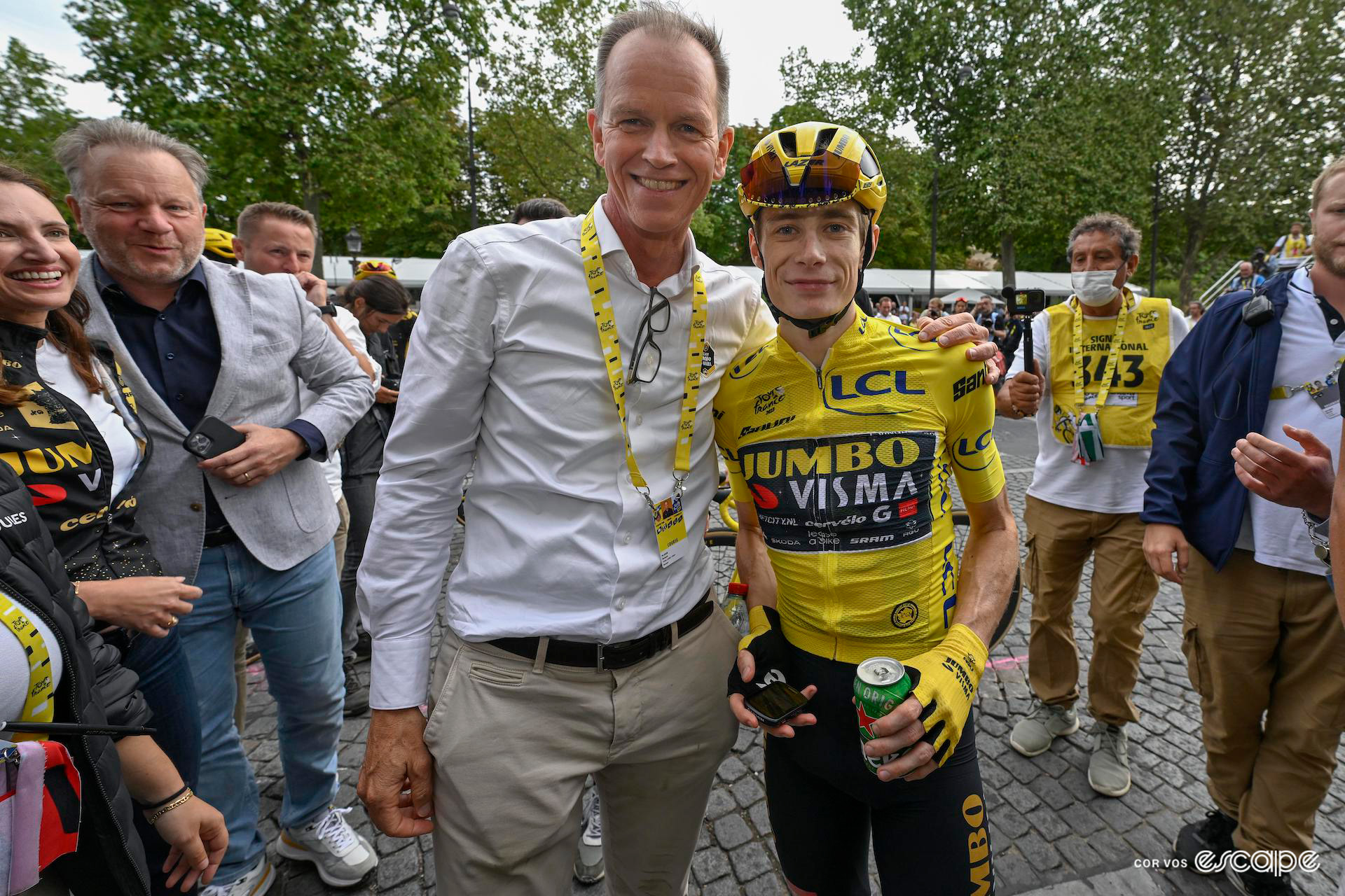Richard Plugge shares a congratulatory hug with Jonas Vingegaard after the 2023 Tour de France.