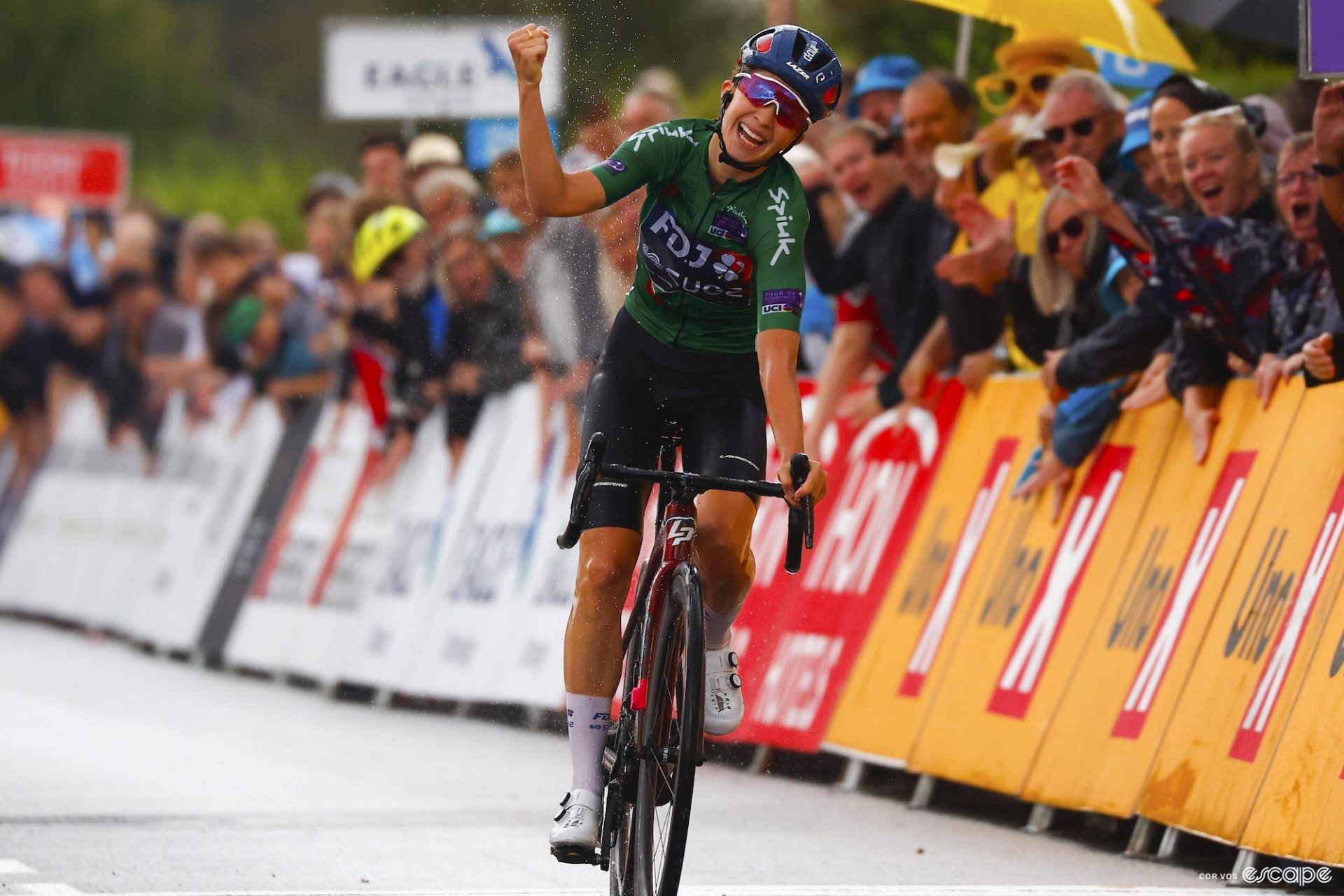 Cecilie Uttrup Ludwig holds one hand in the air as she wins the final stage of the 2023 Tour of Scandinavia. 