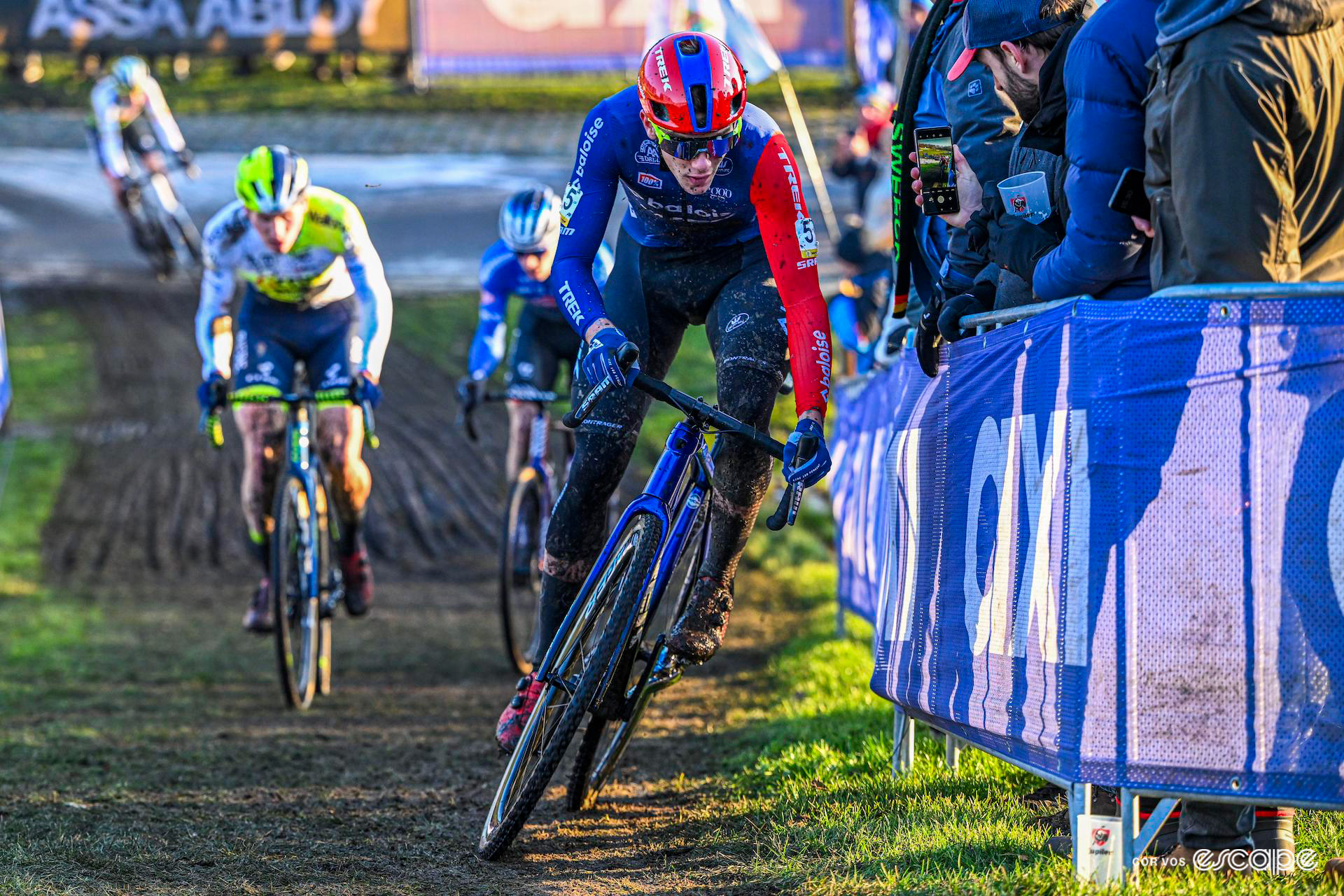 Well wrapped up against the cold, Thibau Nys leans into a corner as he sprints away from his rivals during Cyclocross Superprestige Boom.
