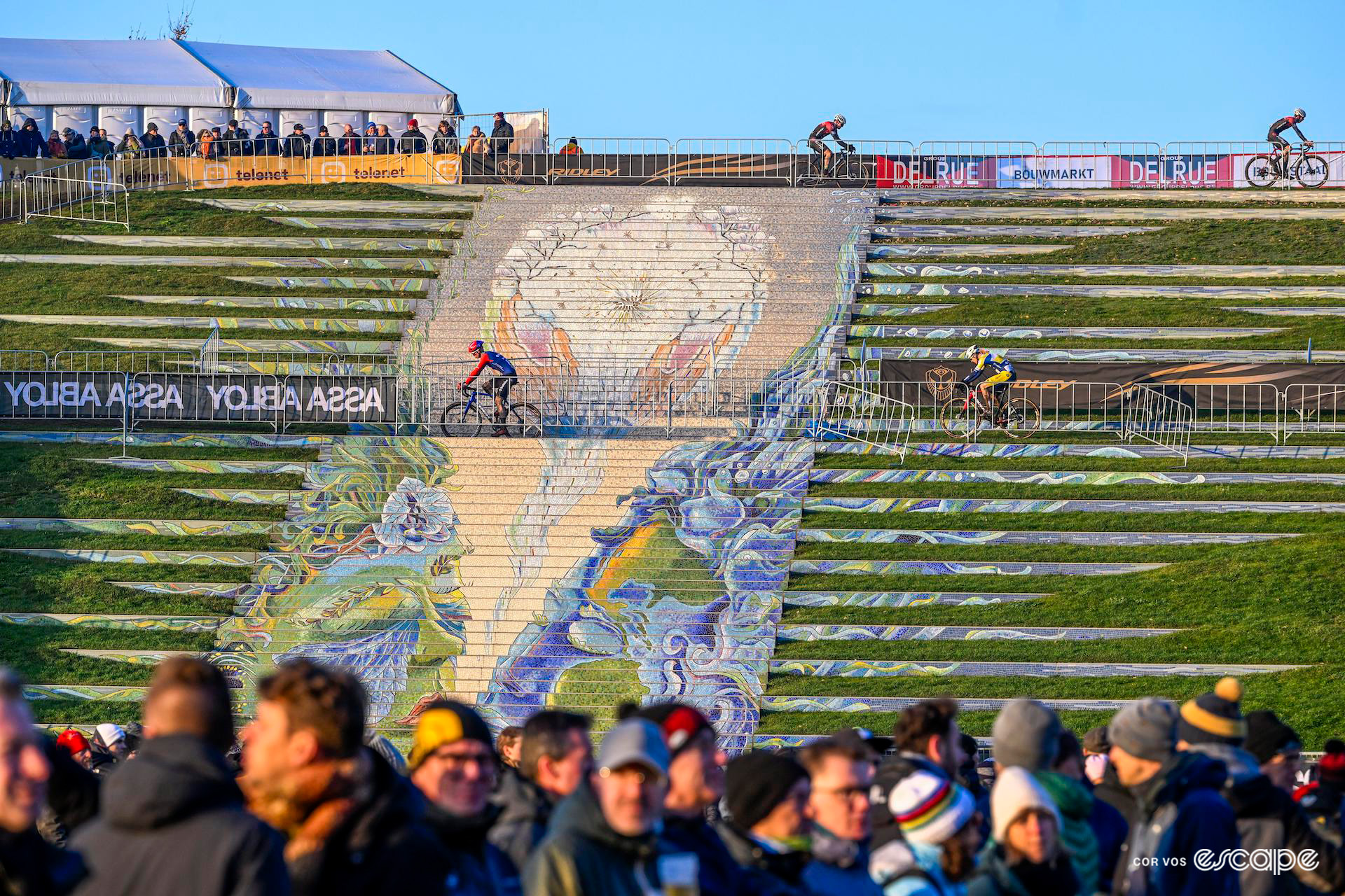 A wide shot of riders on the 'Stairway to Eternity', a 60-metre-long mosaic stairway in the main amphitheatre of De Schorre park, Boom, home of the Tomorrowland festival and Superprestige Boom.