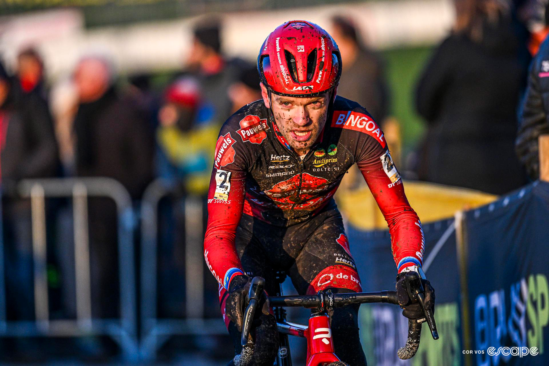 Wrapped up warm, Eli Iserbyt squints in the late-afternoon sun during Cyclocross Superprestige Boom.