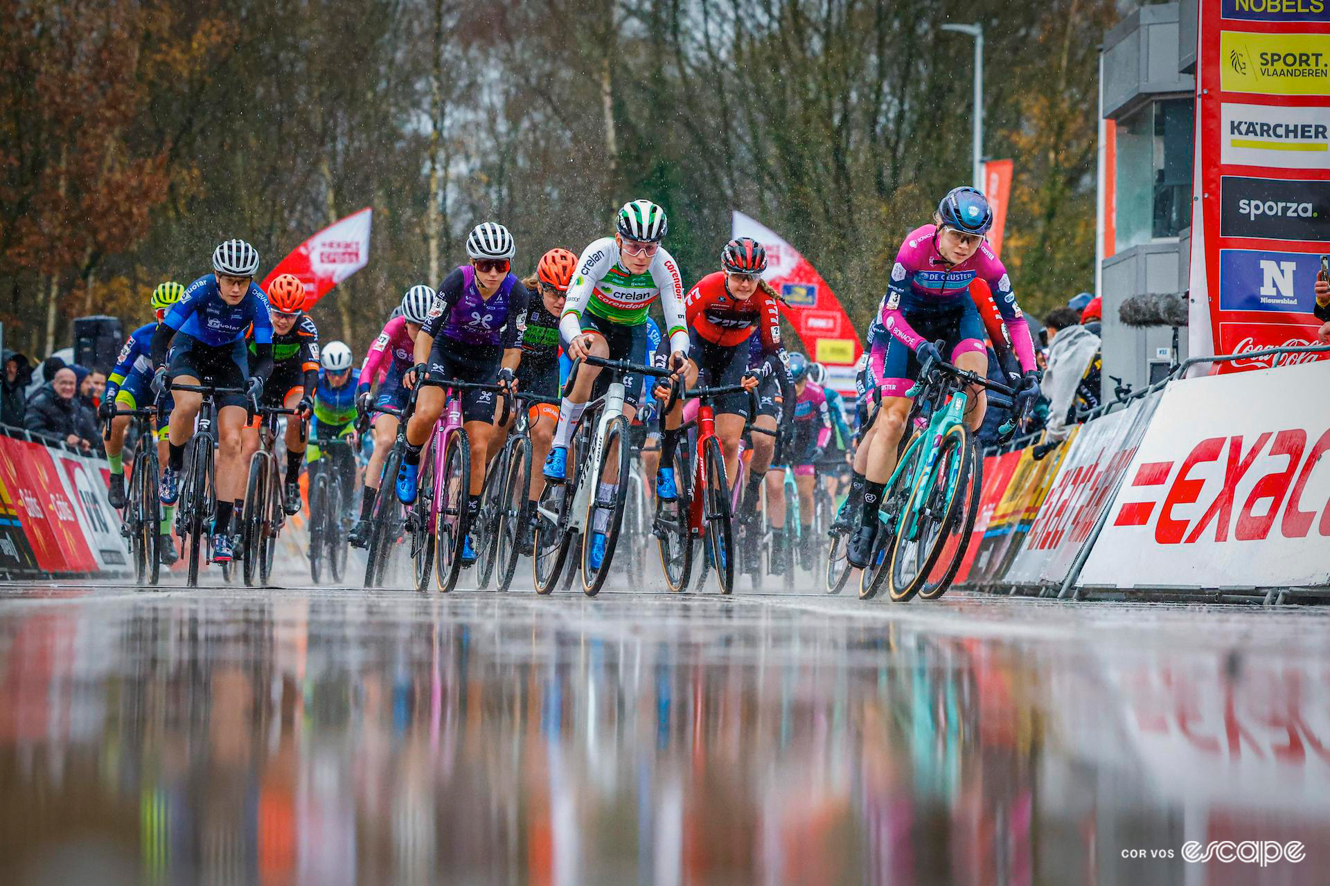 The elite women's field leaves the start line at a very wet and muddy Exact Cross Essen.
