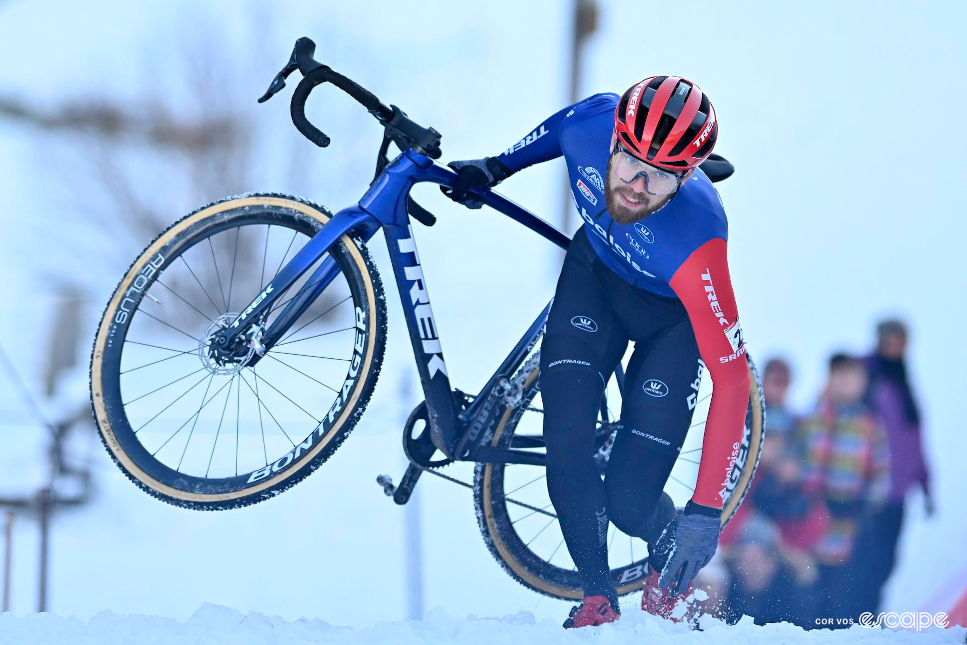 Joris Nieuwenhuis gets up off the snow, bike in hand, during UCI Cyclocross World Cup Val di Sole.