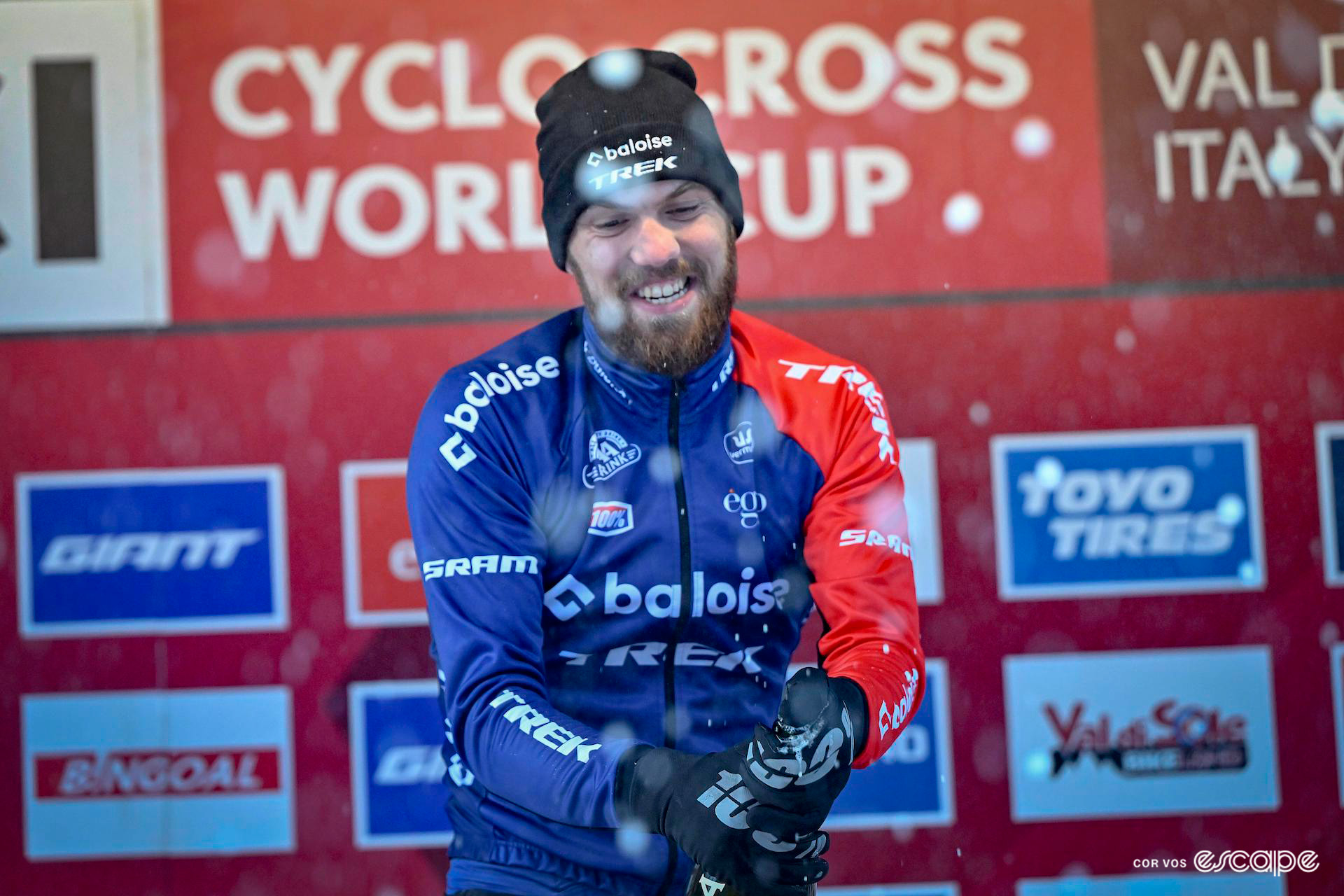 Joris Nieuwenhuis sprays Prosecco on the podium at UCI Cyclocross World Cup Val di Sole.