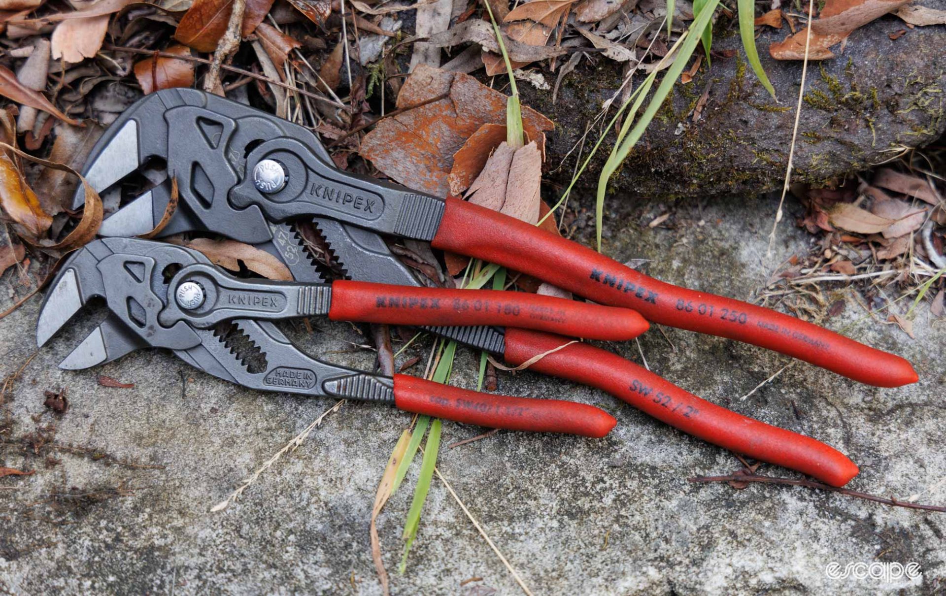 A 180 mm and a 250 mm Knipex Pliers Wrench on a rock. 