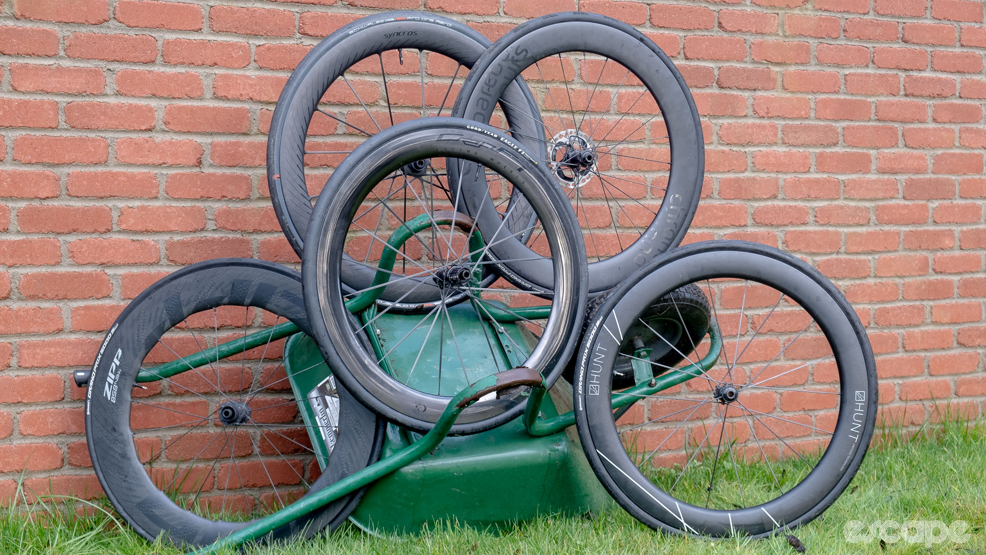 The photo shows a group of deep rim carbon wheelsets. 