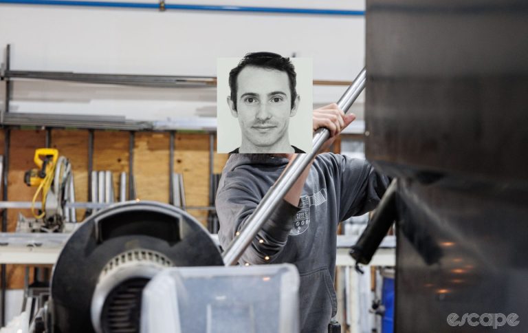 An Abbey Bike Tools employee feeds tube stock into a machine. Dave's face is jankily superimposed over the employee's.