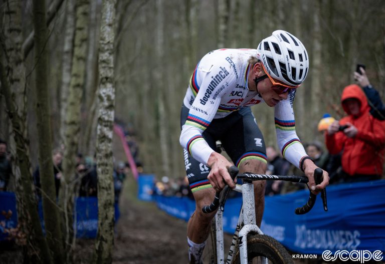Mathieu van der Poel tops a climb at the X2O Cyclocross Herentals. He's all alone, having gone solo on the first lap. The woods are dark and moody.
