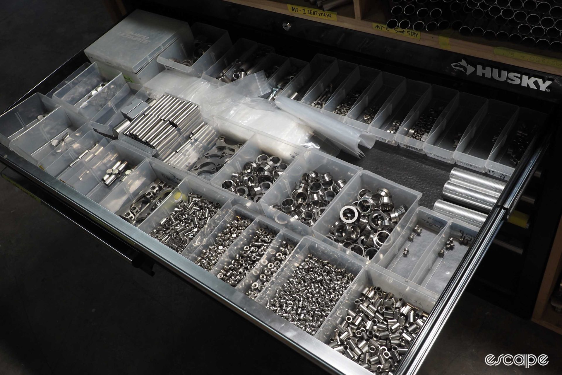 Another drawer in a tool chest holds an array of titanium bits for cable routing, axle nuts, and other uses.