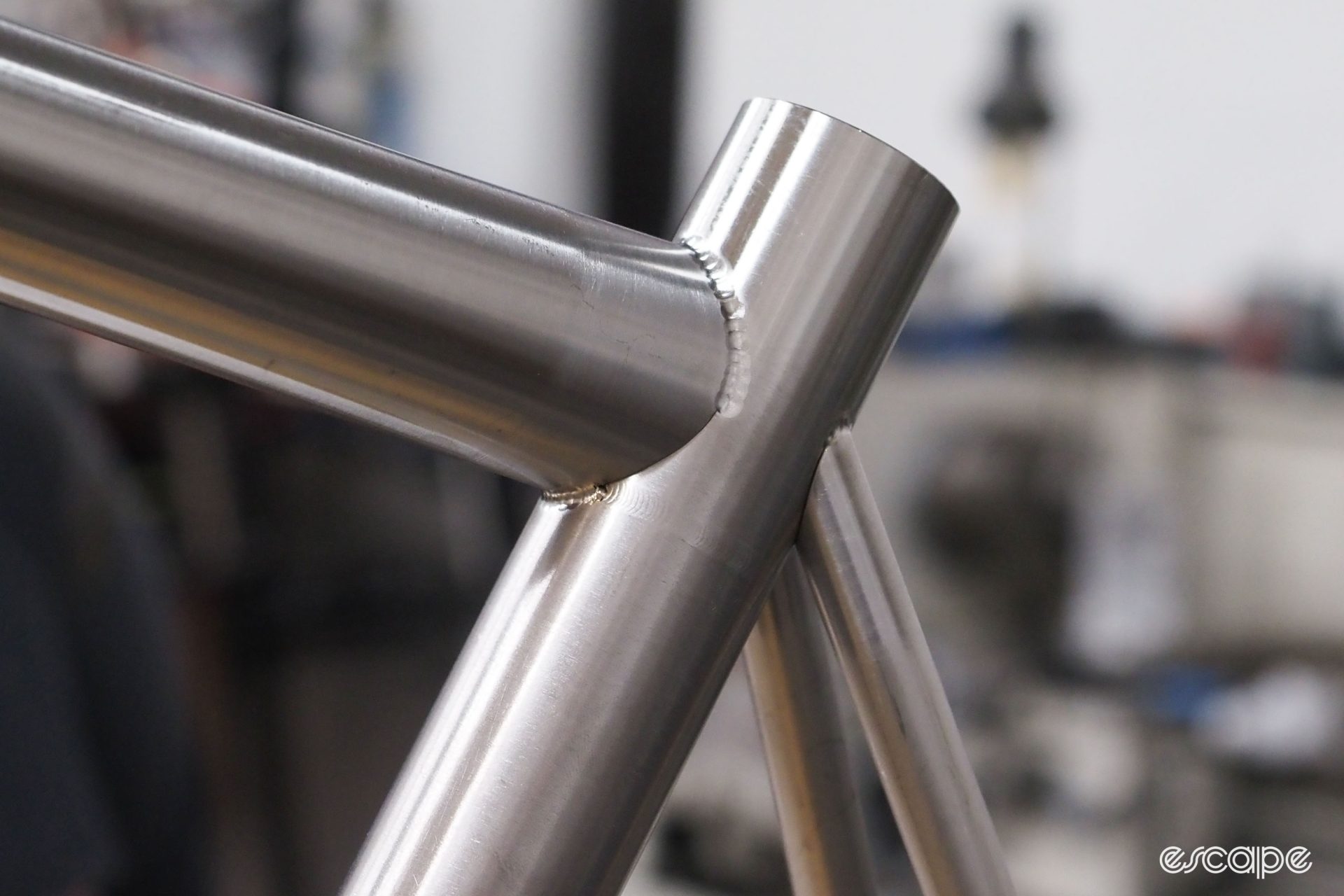 A closeup of a frame in a welding jig, showing the first run of "fusion welds" to essentially tack the tubes together. Shown is the seat cluster.