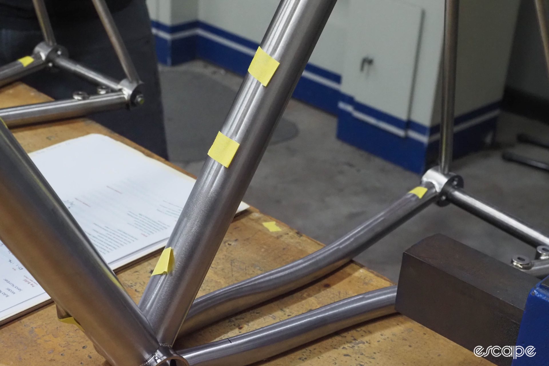 A frame readied for welding has the holes for bottle mounts and cable routing sealed to keep the argon gas inside the tubes.