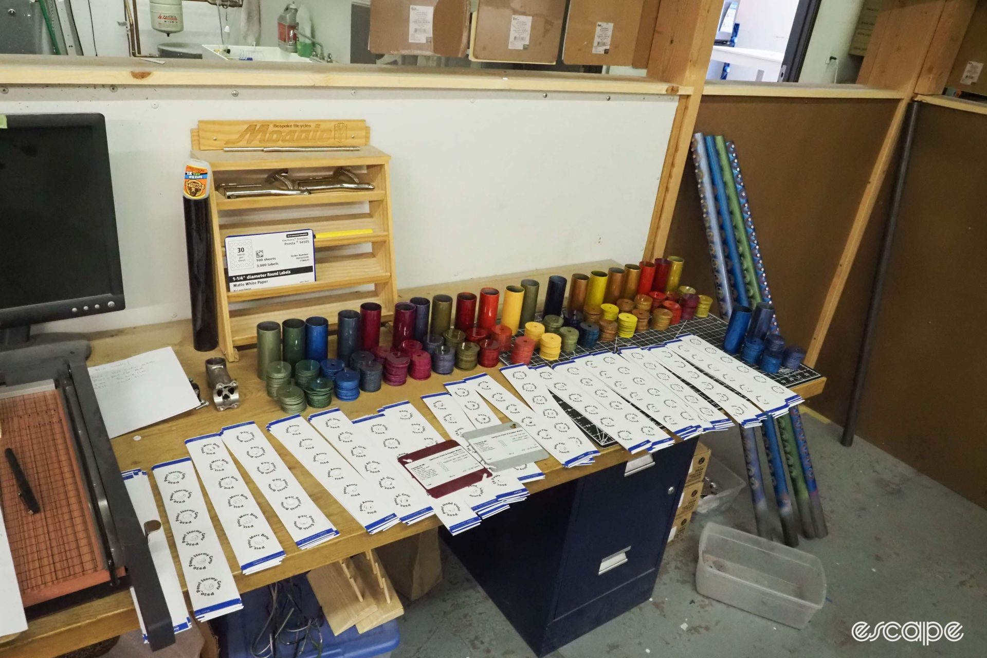 Paint samples are laid out on a table to box and ship to dealers.