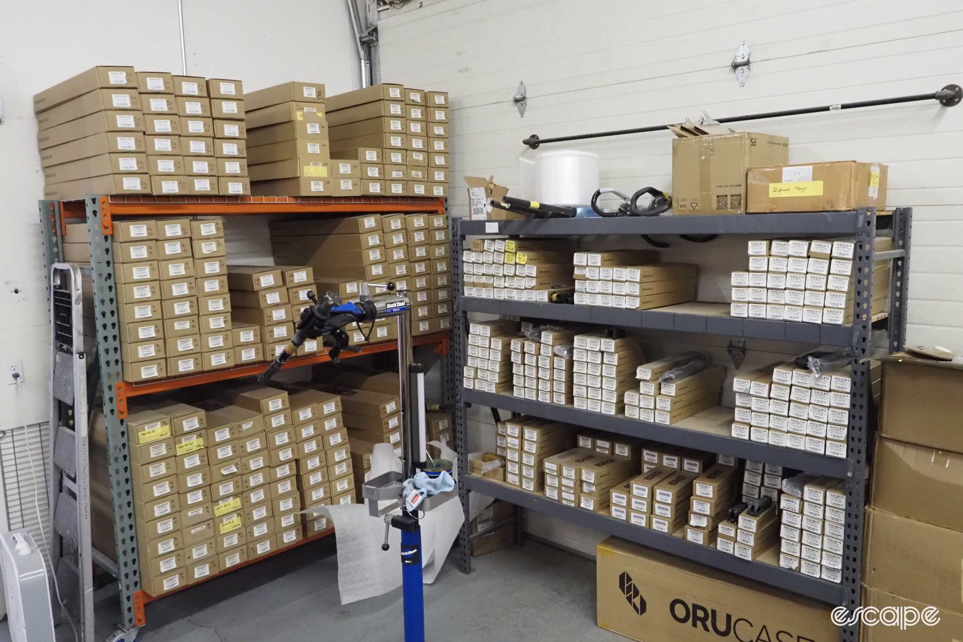 Boxes and boxes of different kind of forks sit stacked on shelving.