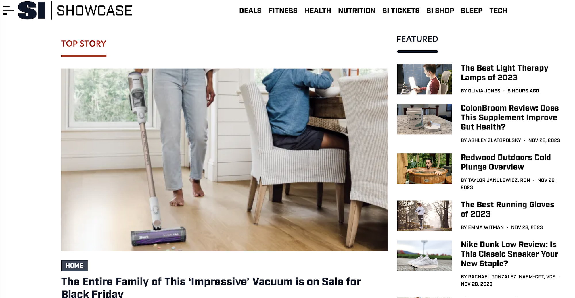 A screen shot of SI Showcase's homepage on November 30, 2023. The featured story is headlined "The entire family of this 'impressive' vacuum is on sale for Black Friday." Other stories on the right sidebar are about light therapy lamps, the best running shoes, and a review of a supplement called ColonBroom.