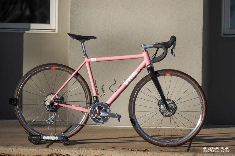 Pink Vynl aluminum gravel bike rear three-side view