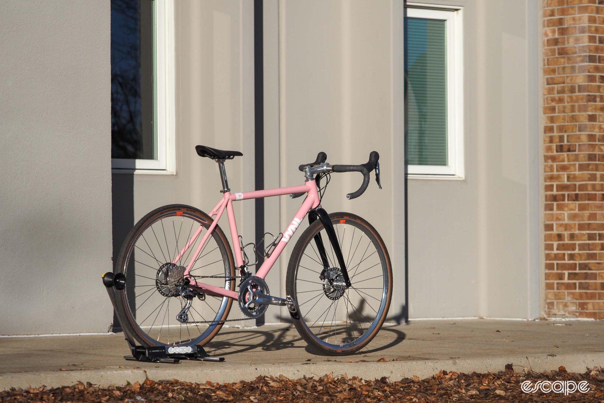 Pink Vynl aluminum gravel bike rear three-quarter view