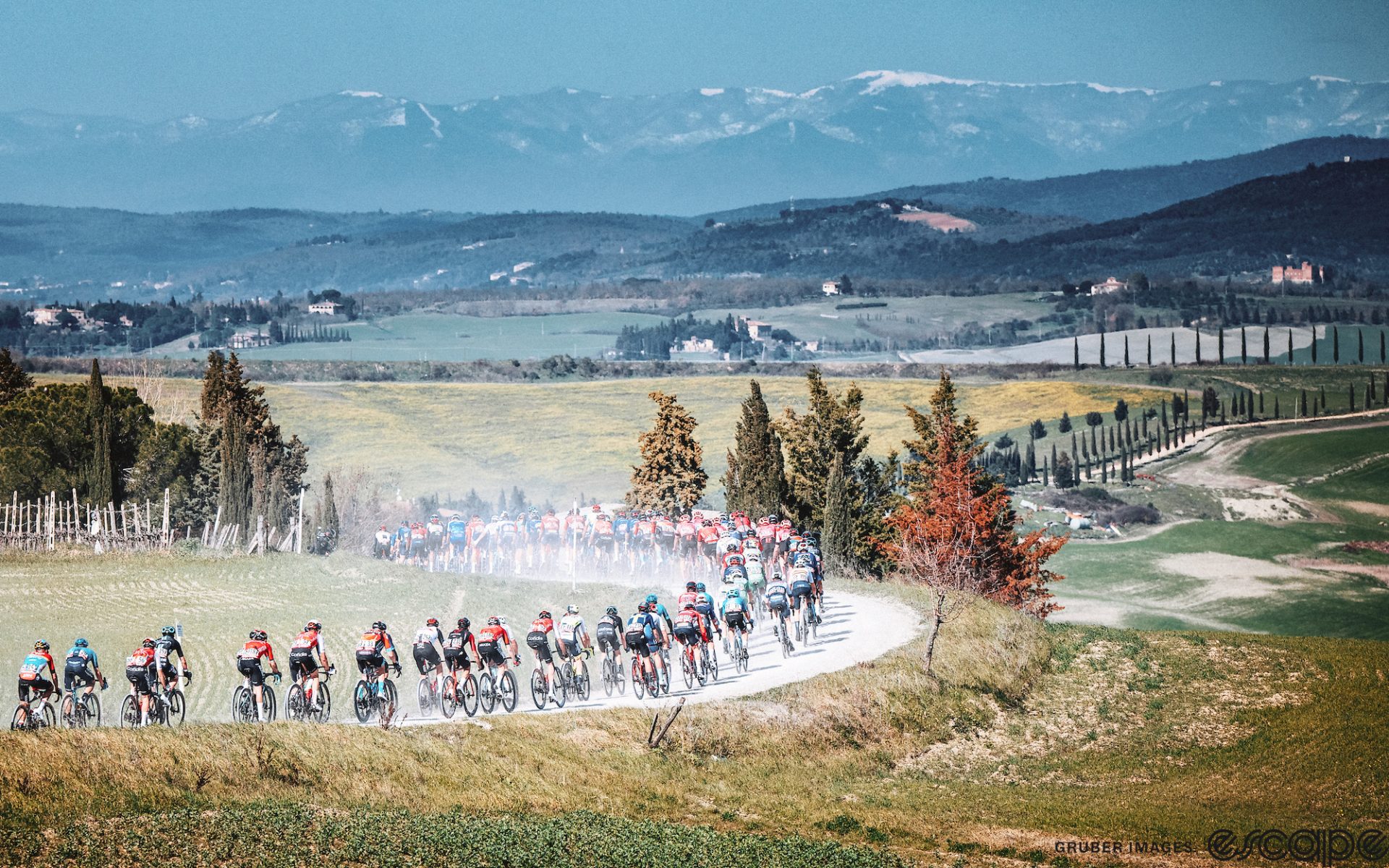 The women's peloton races at the 2023 Strade Bianche.