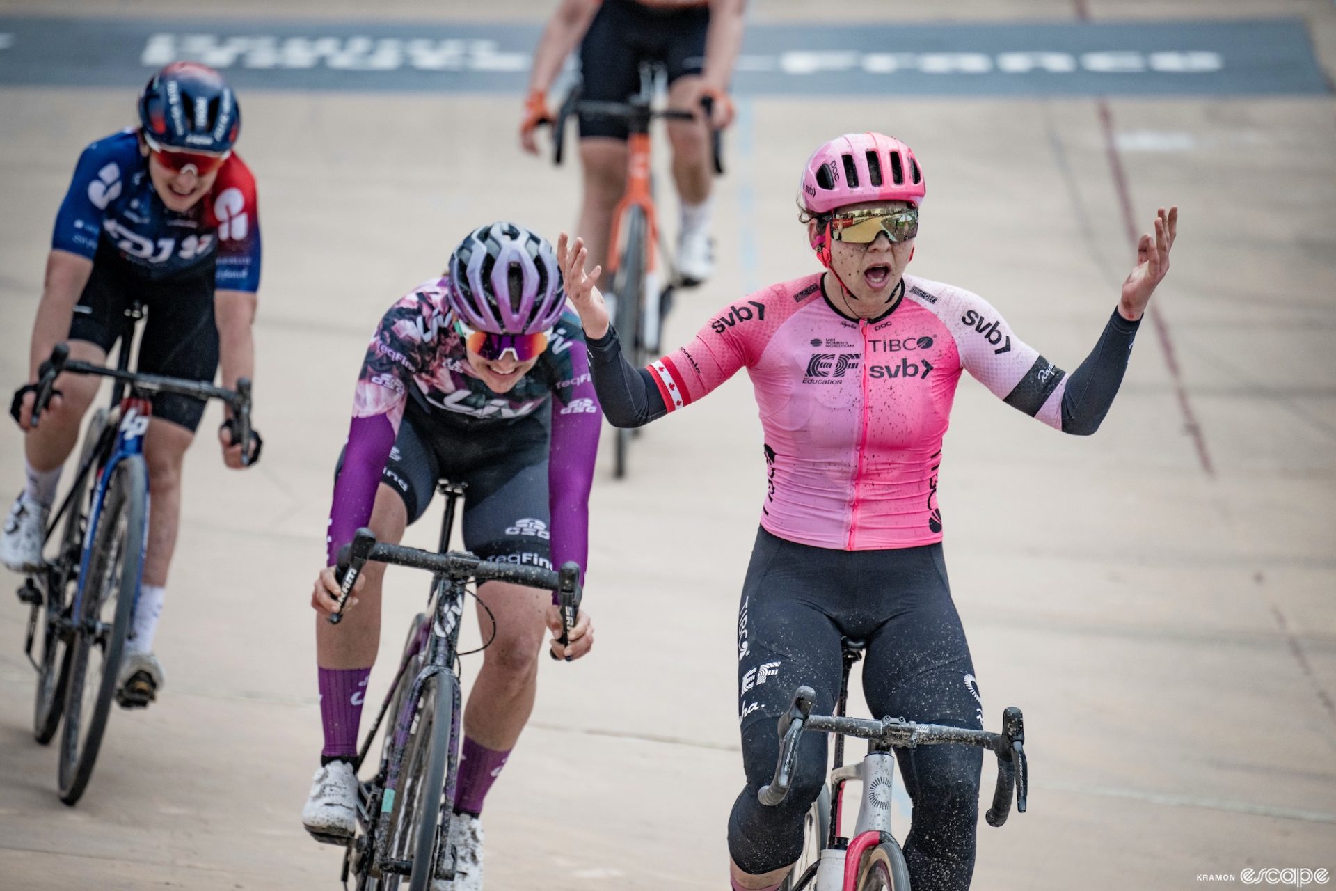 Alison Jackson gestures in shock as she wins Paris-Roubaix in a velodrome sprint.