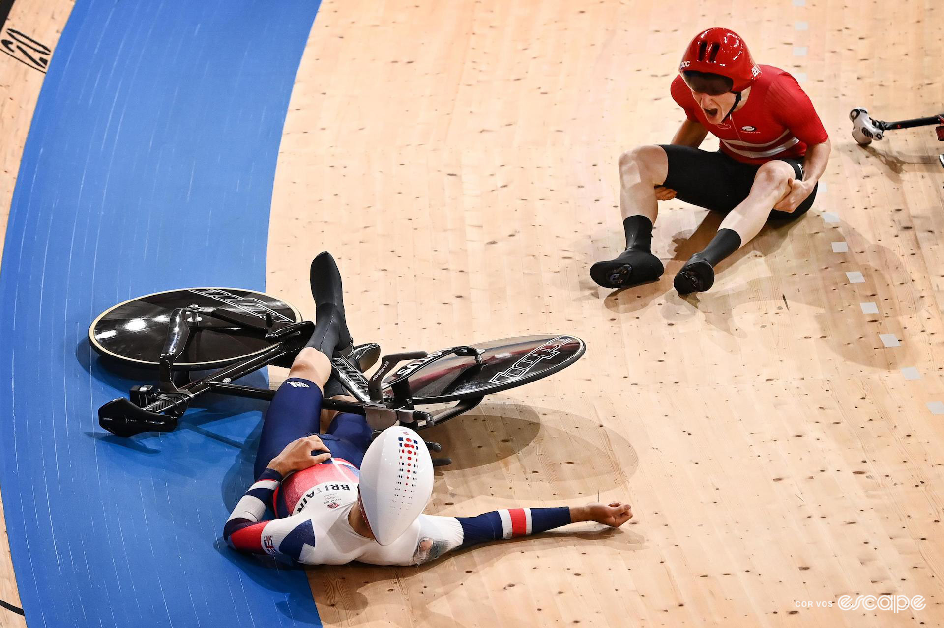 Charlie Tanfield of Great Britain and Fredrik Rodenberg of Denmark immediately after crashing during the Team Pursuit track event at the Tokyo Olympics.