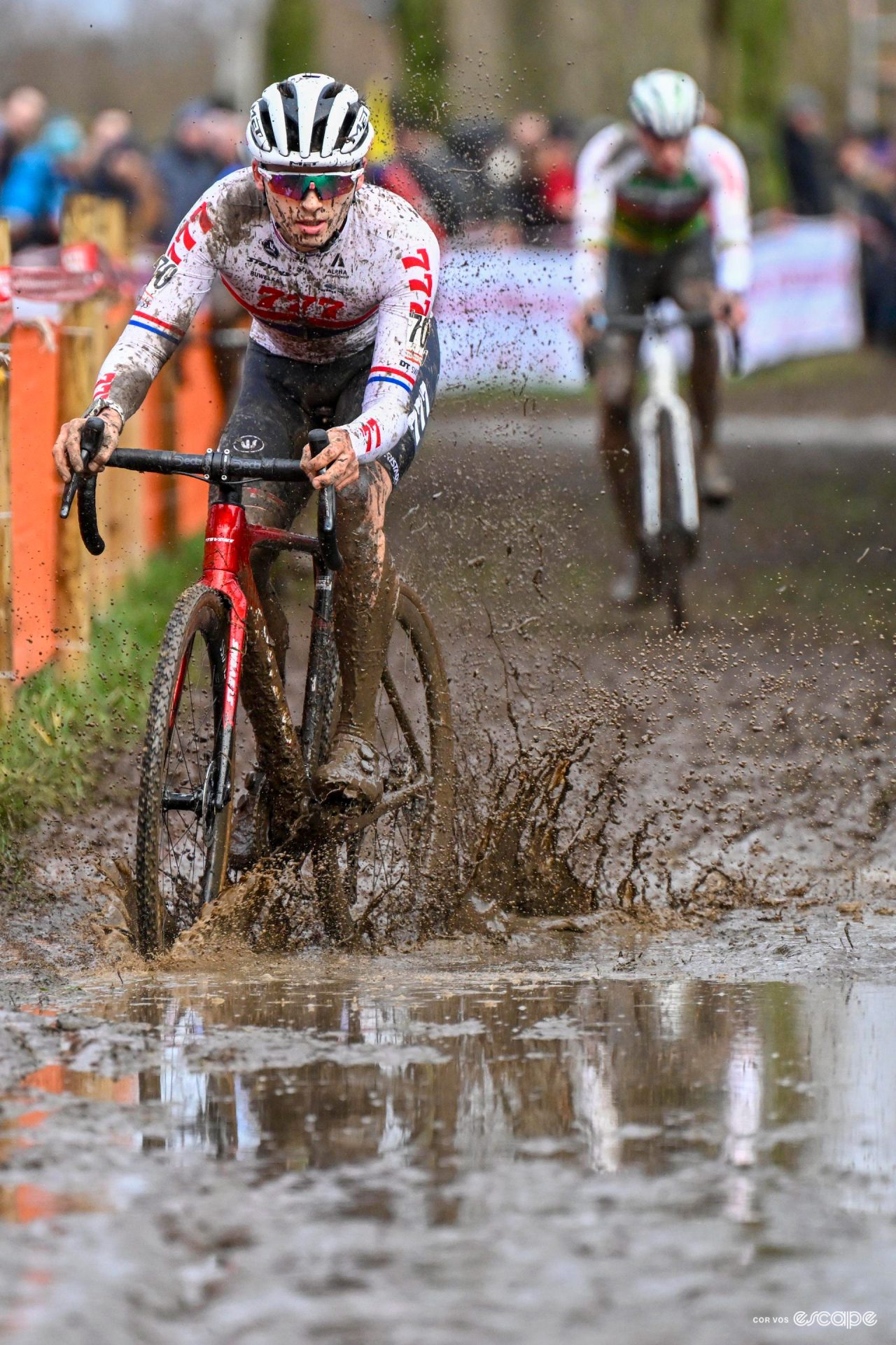 British national champion Cameron Mason enters a muddy puddle during Hexia Cyclocross Gullegem.
