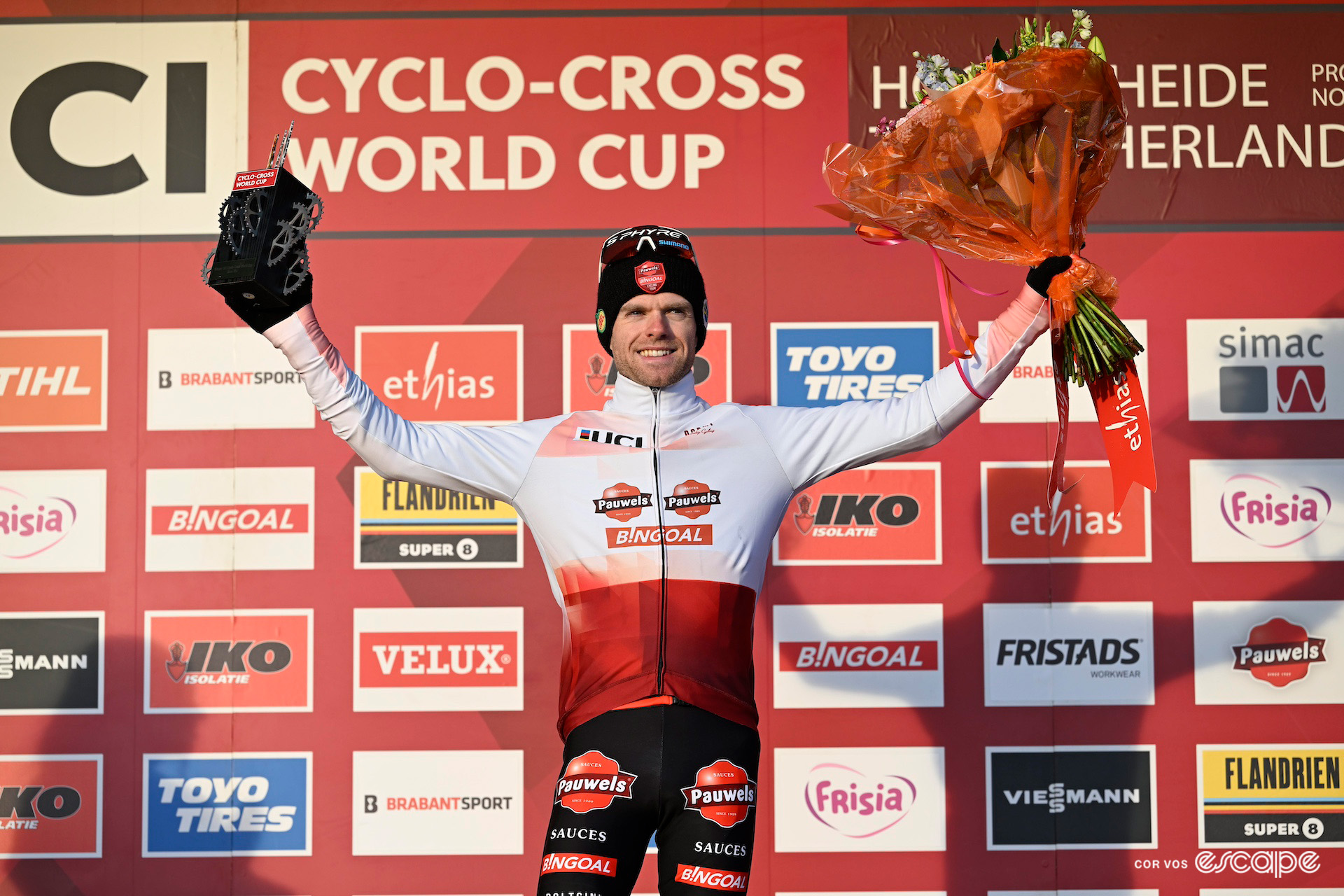 Eli Iserbyt accepts the jersey and trophy of overall CX World Cup winner after CX World Cup Hoogerheide.