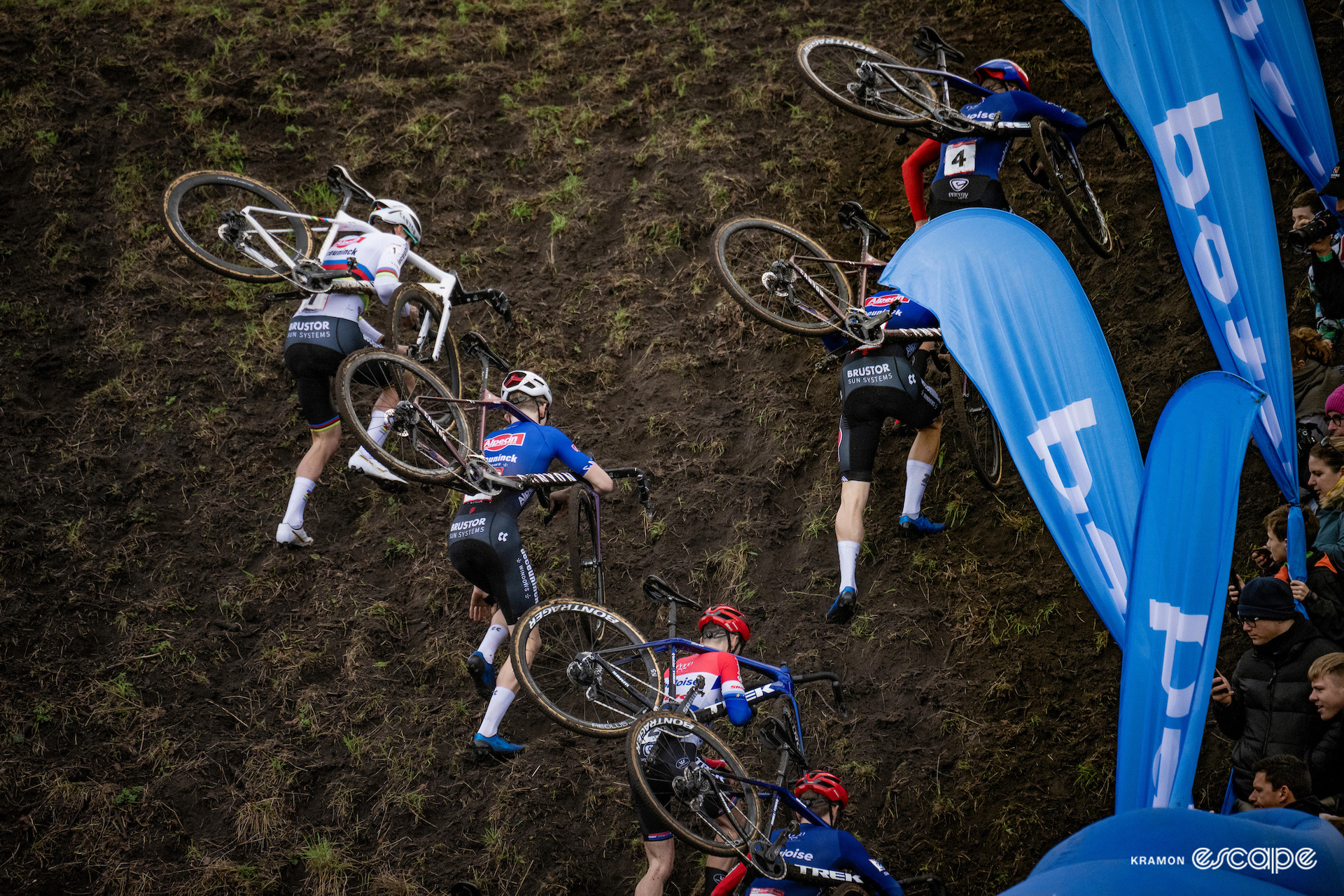 The leaders of the elite men's field scramble up a super-steep climb during CX World Cup Hulst.
