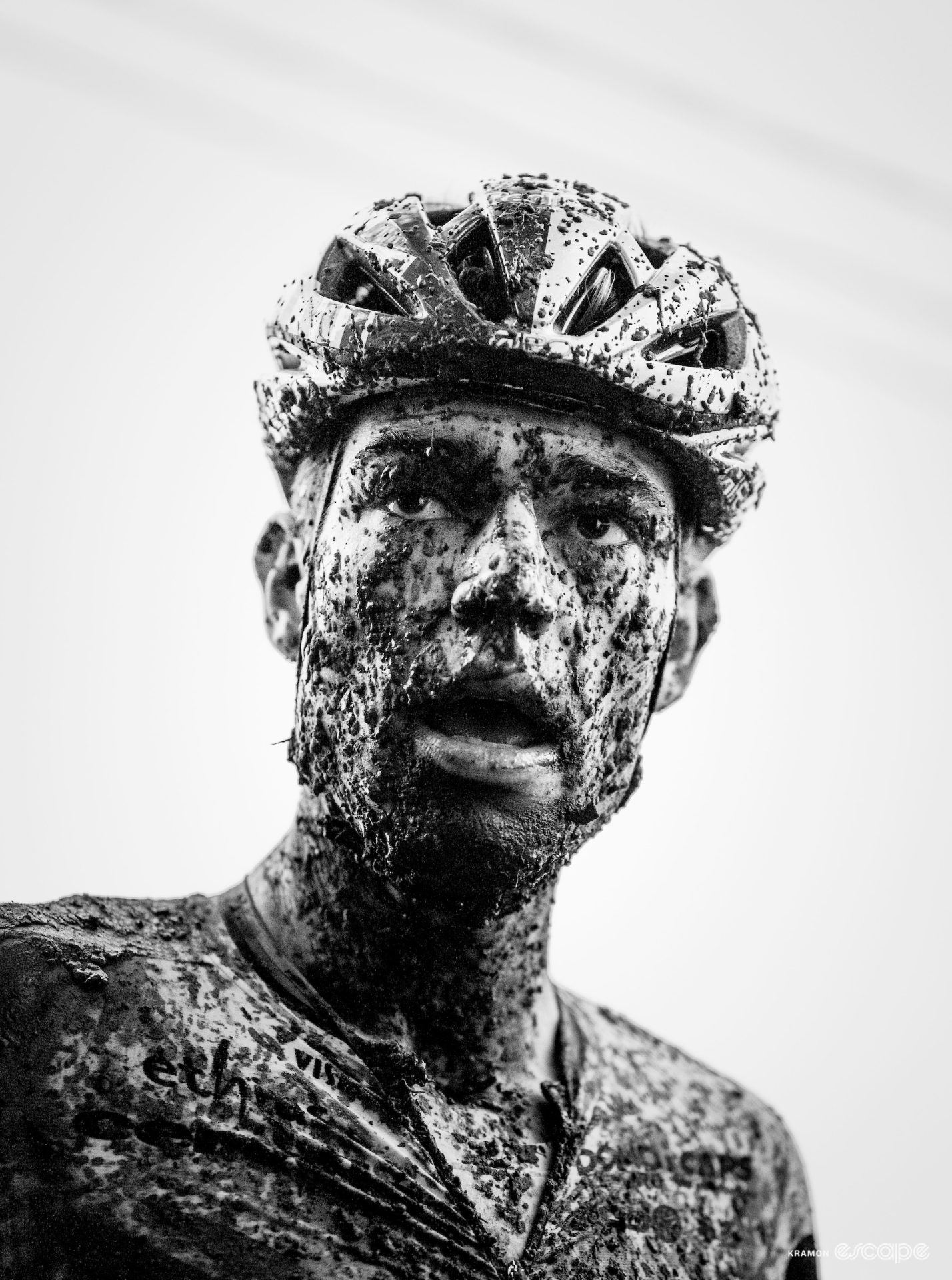 Black and white profile of Wout van Aert, covered in mud, after finishing second at the GP Sven Nys, X2O Trofee Baal.