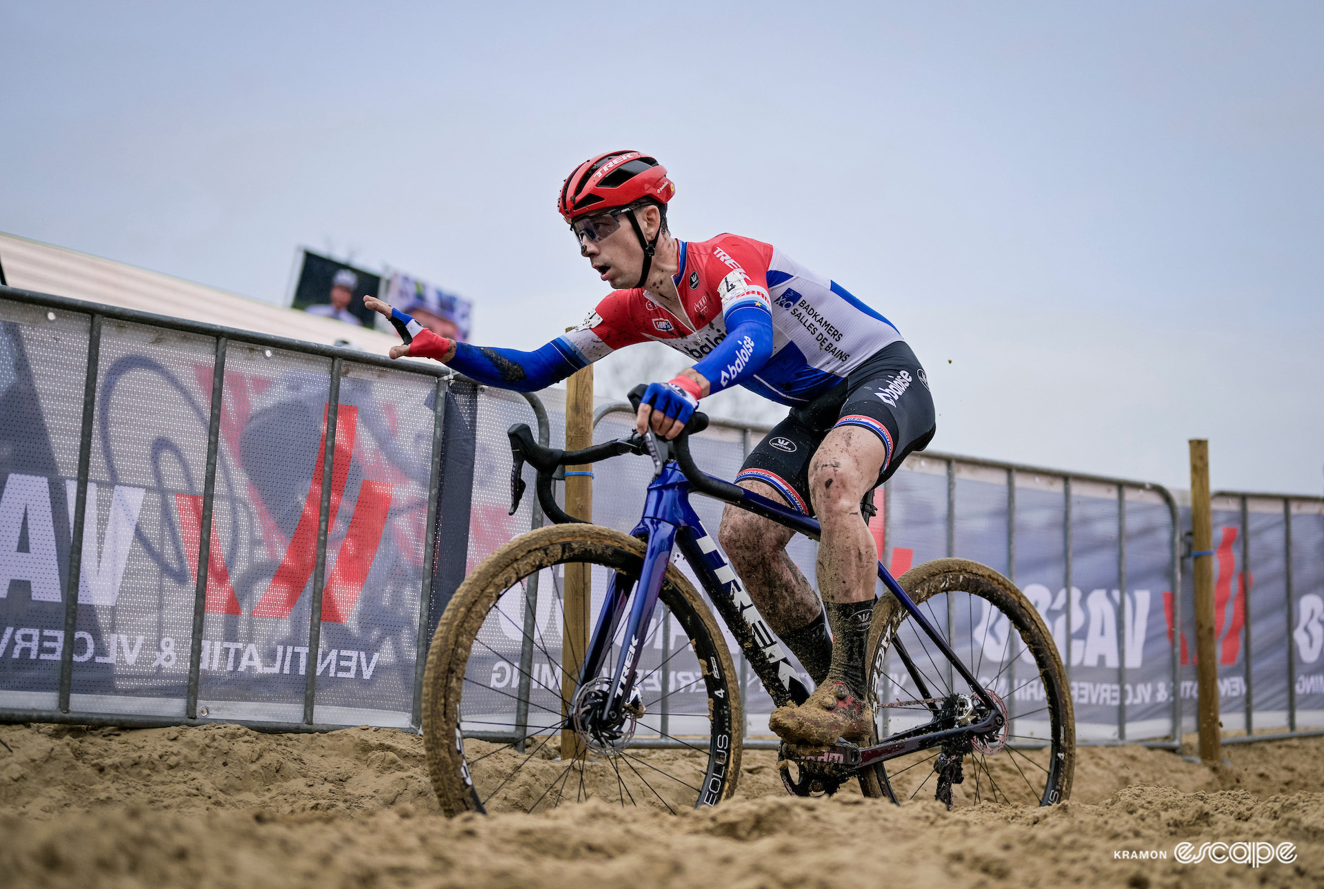 Dutch national champion Lars van der Haar grabs hold of a barrier to pull himself through the sand during X2O Trofee Koksijde - Vlaamse Duinencross.