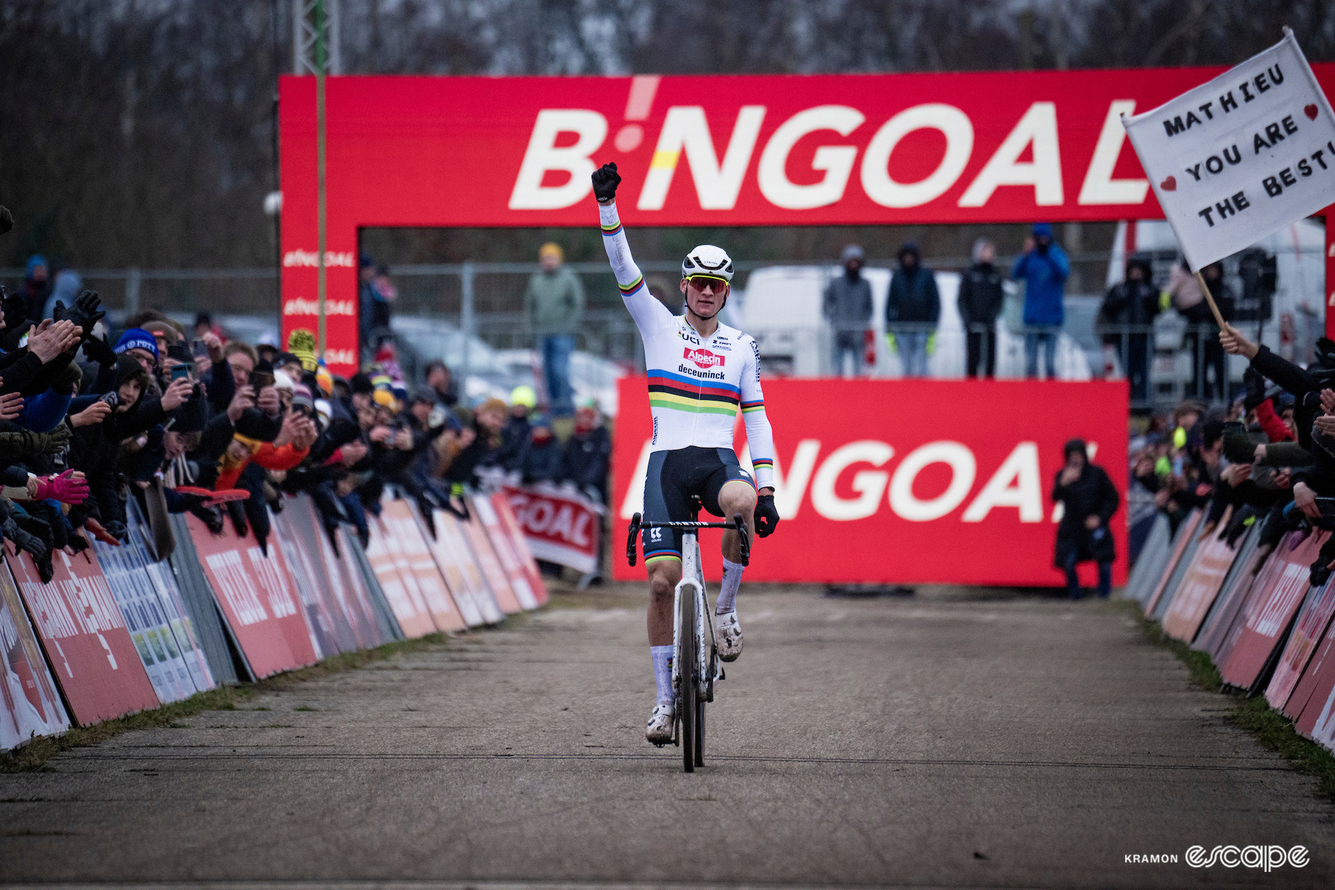 Mathieu van der Poel punches the air in celebration as he crosses the finish line victorious at UCI World Cup Zonhoven.