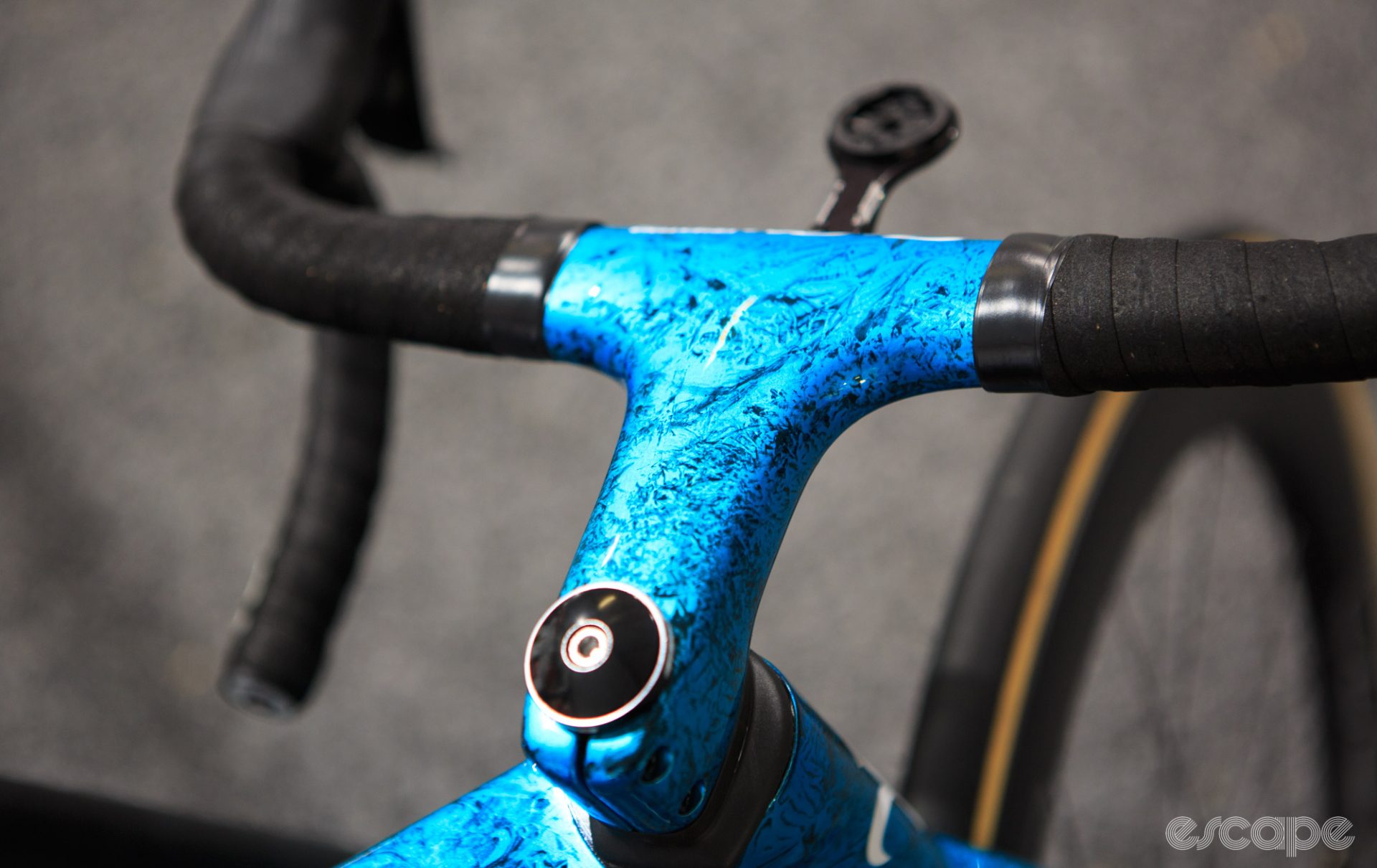 One-piece bar stem with pearl blue paint.
