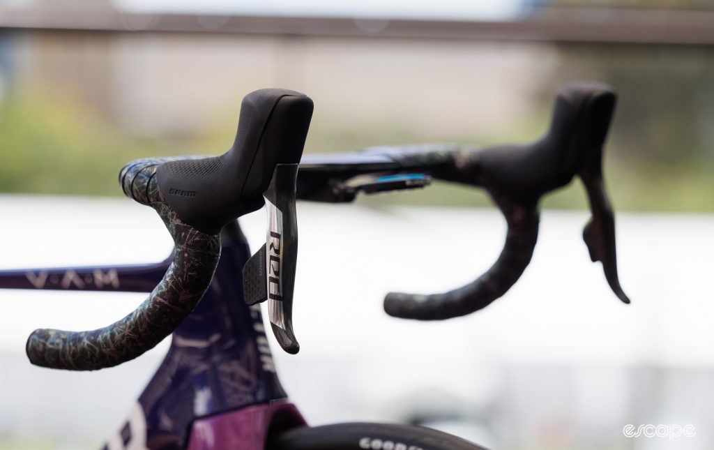 The image shows SRAM RED AXS levers on a Factor bike.