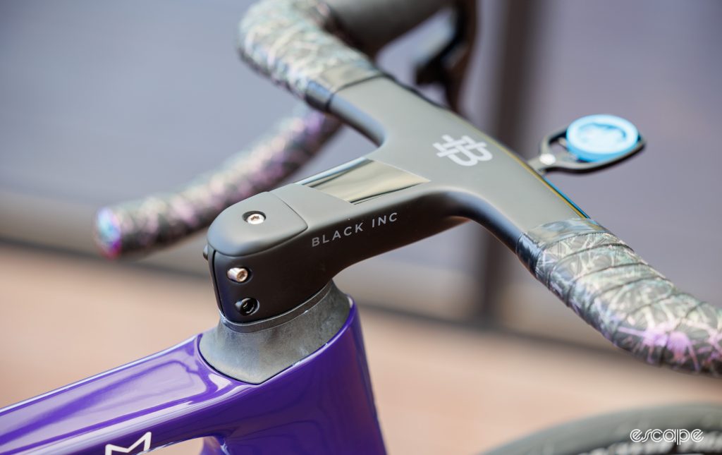 The image shows Black Inc handlebars on a Factor bike.