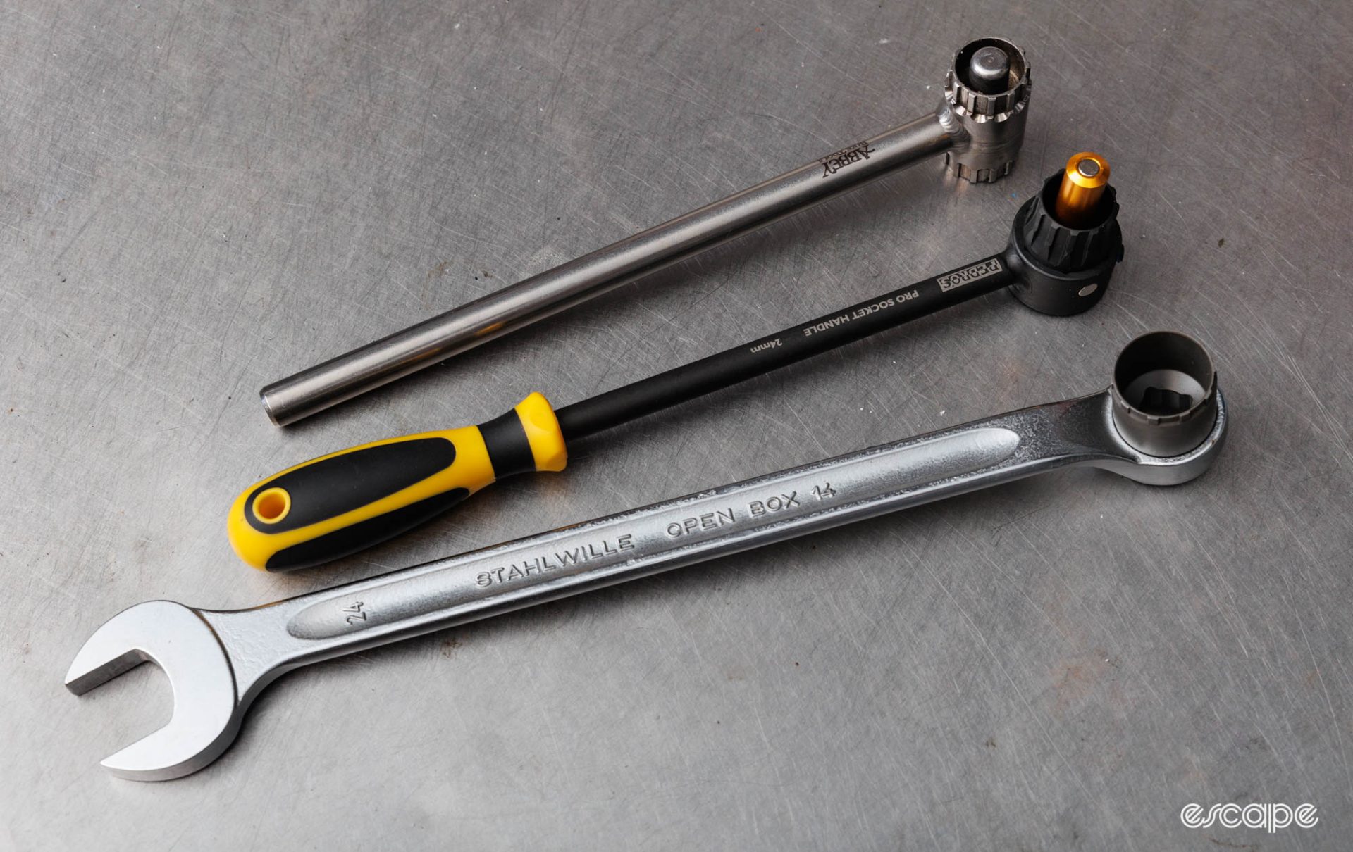 The Pedros' Pro Socket Handle sits between a long 24 mm spanner and an Abbey Crombie dual-sided wrench. 