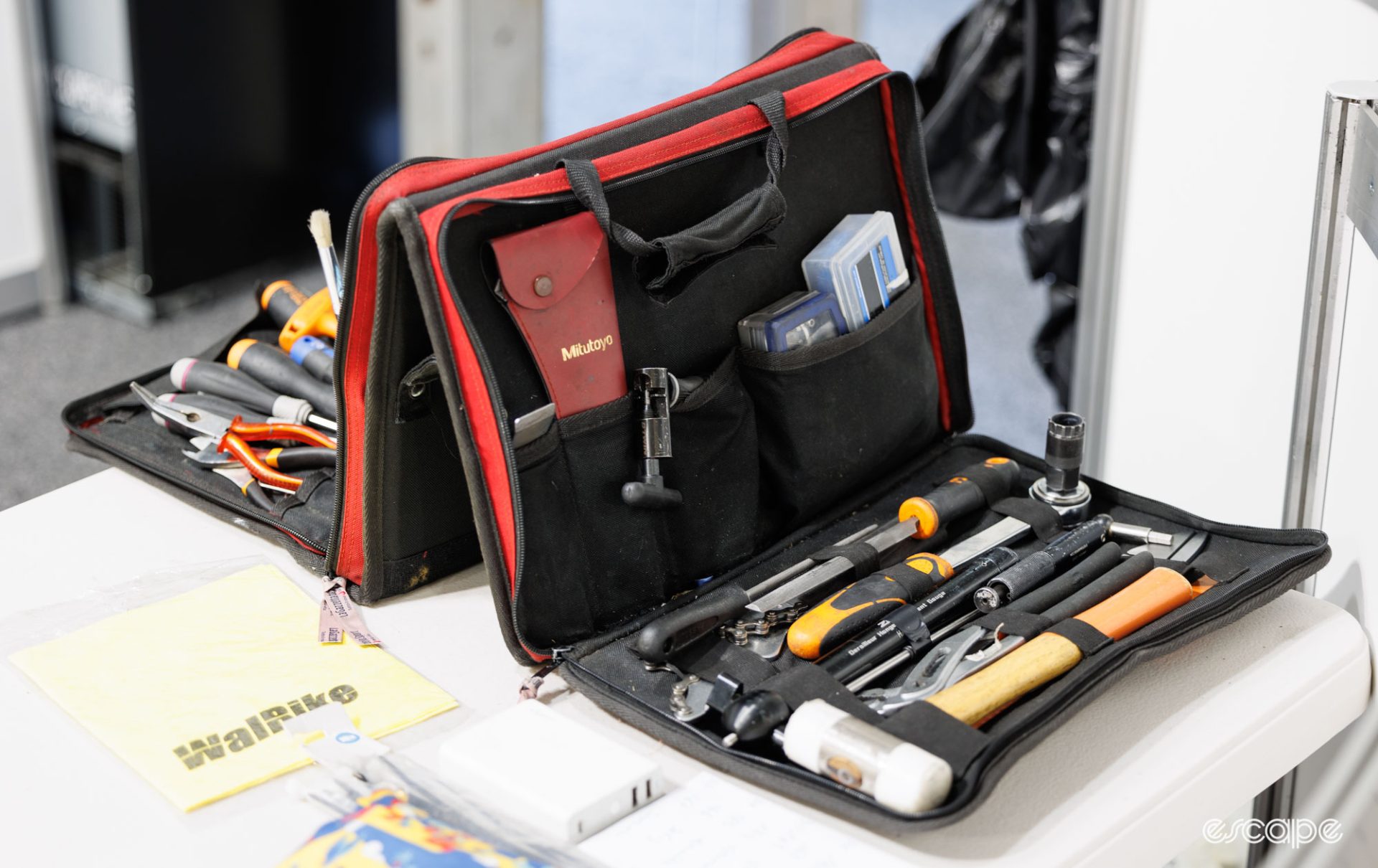 A portable tool folder filled with bicycle tools. 